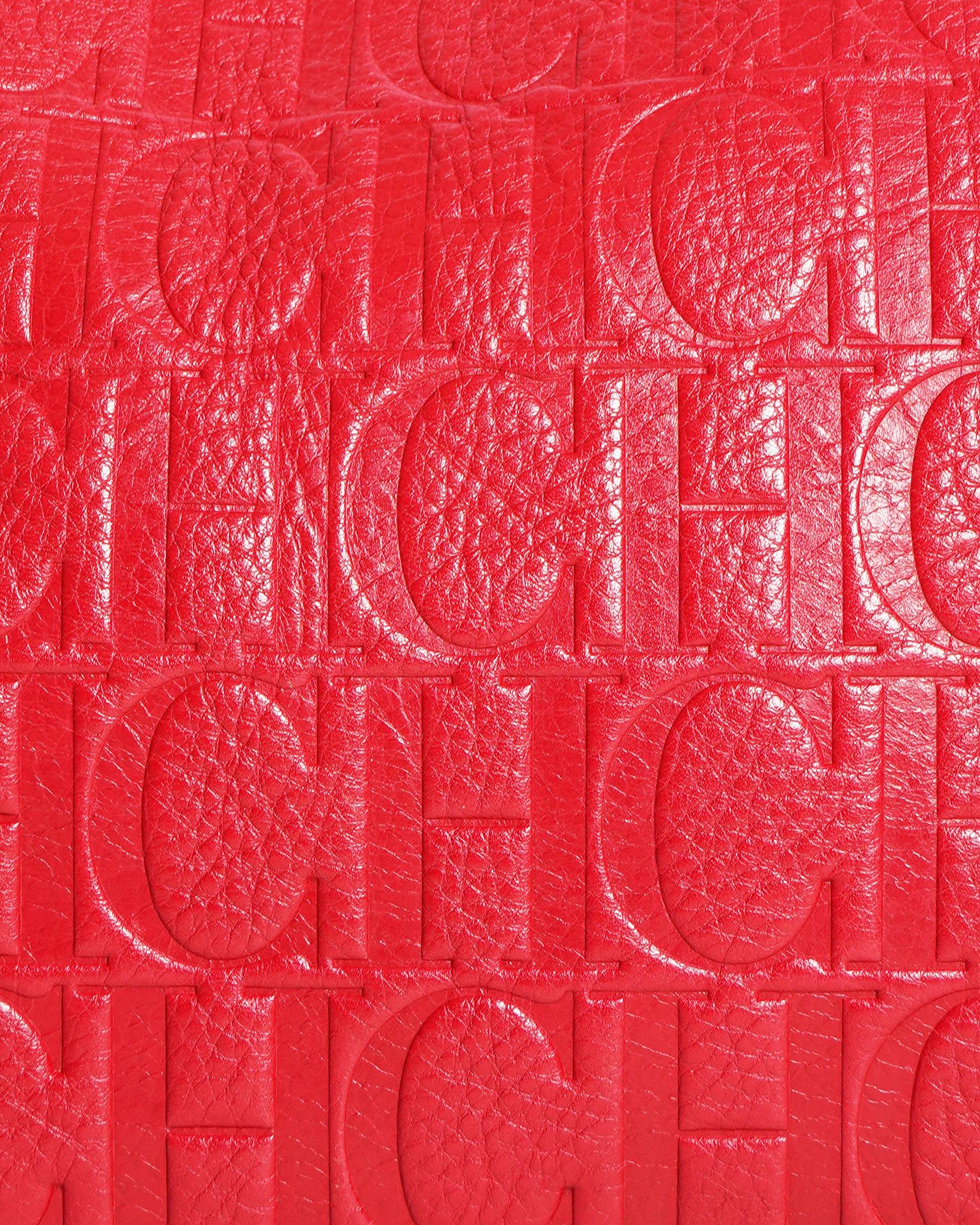 Caroline herrera red monogram embossed leather clutch with chain