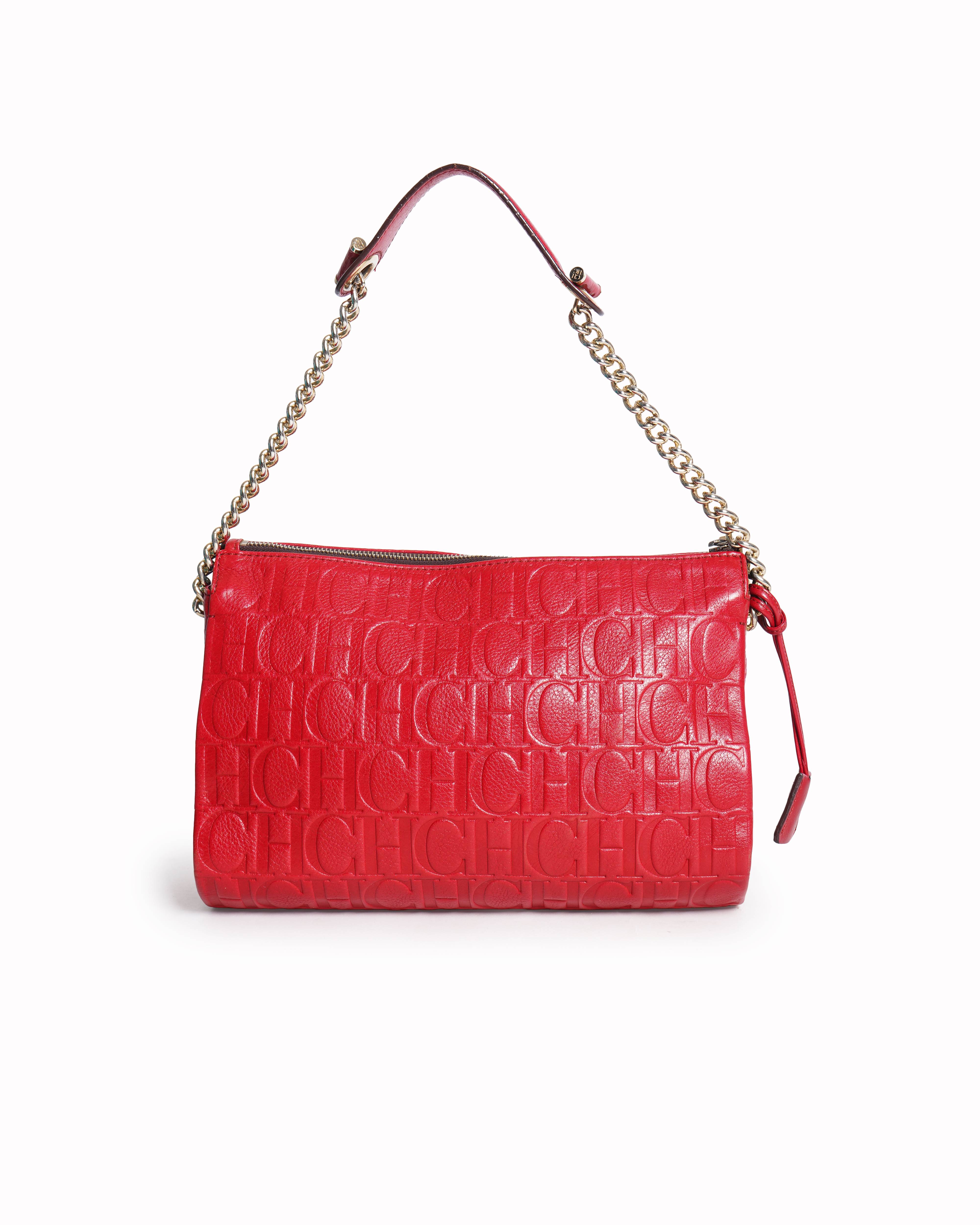 Caroline herrera red monogram embossed leather clutch with chain
