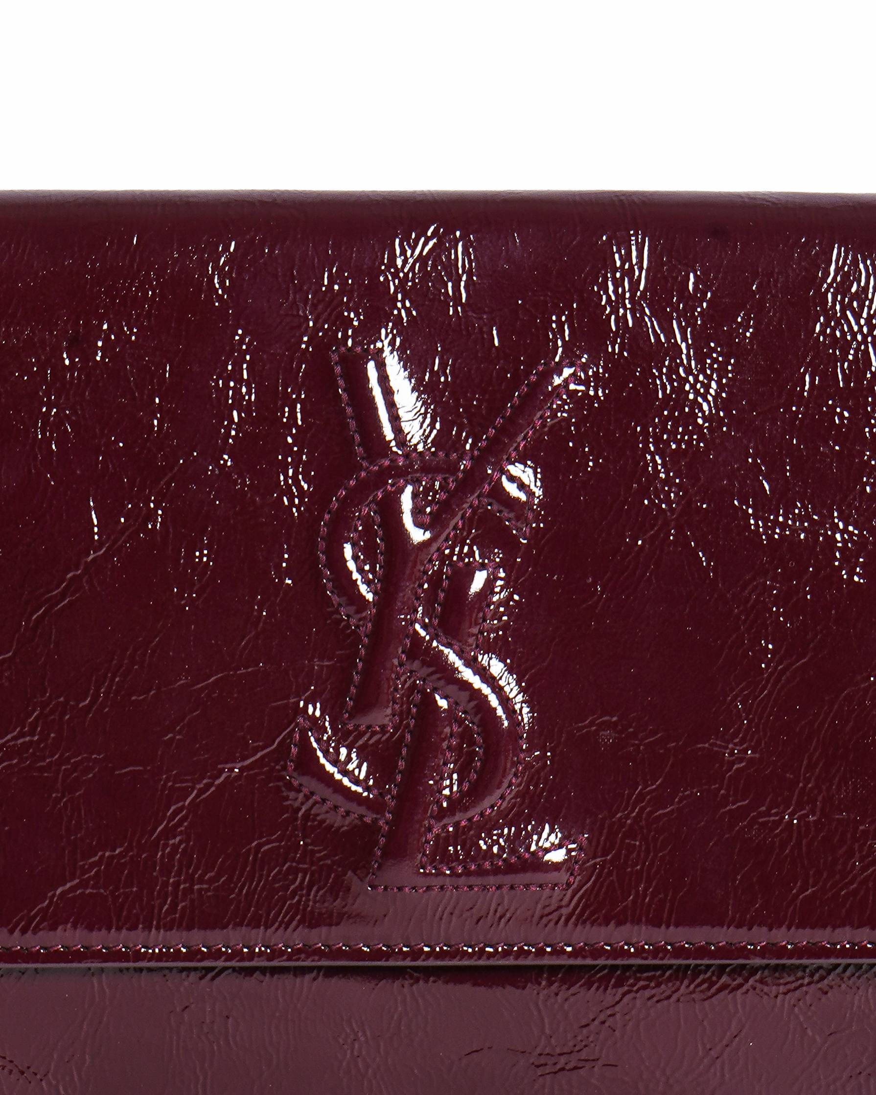 Yves Saint Laurent aged leather clutch In burgundy