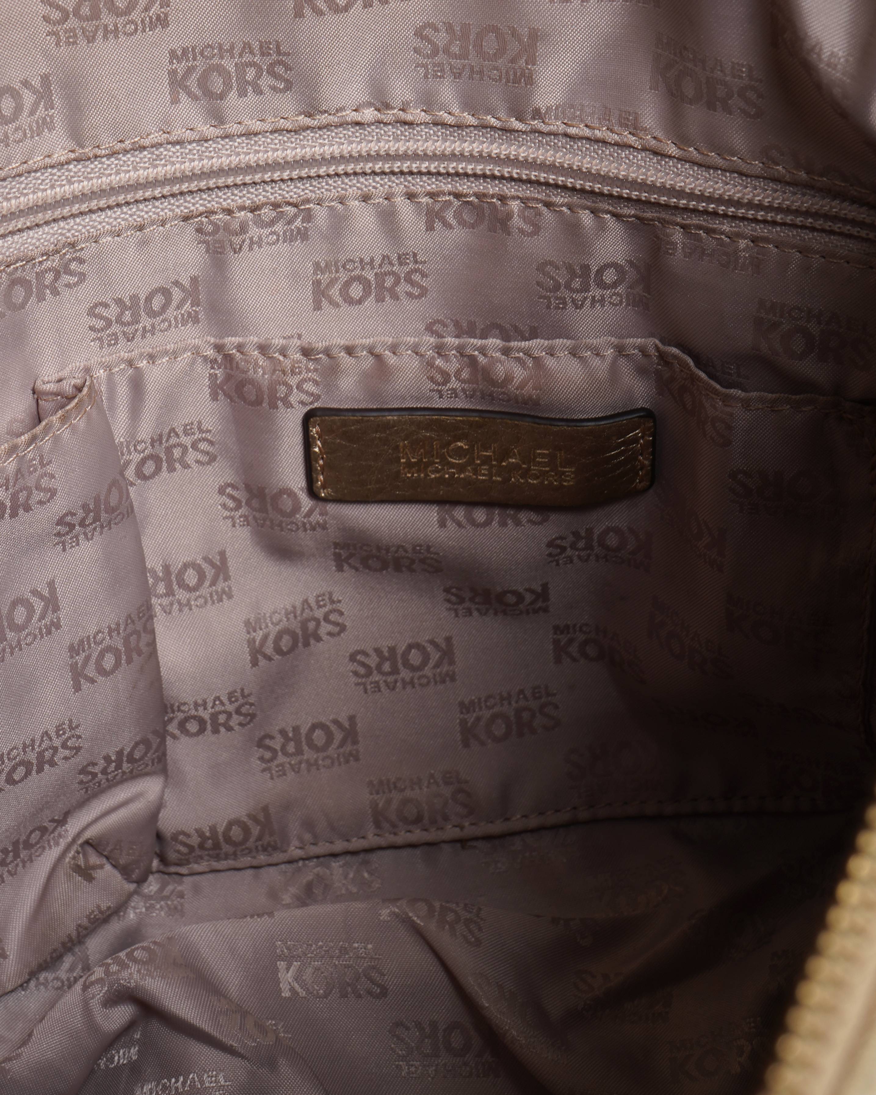 Michael kors golden handbag