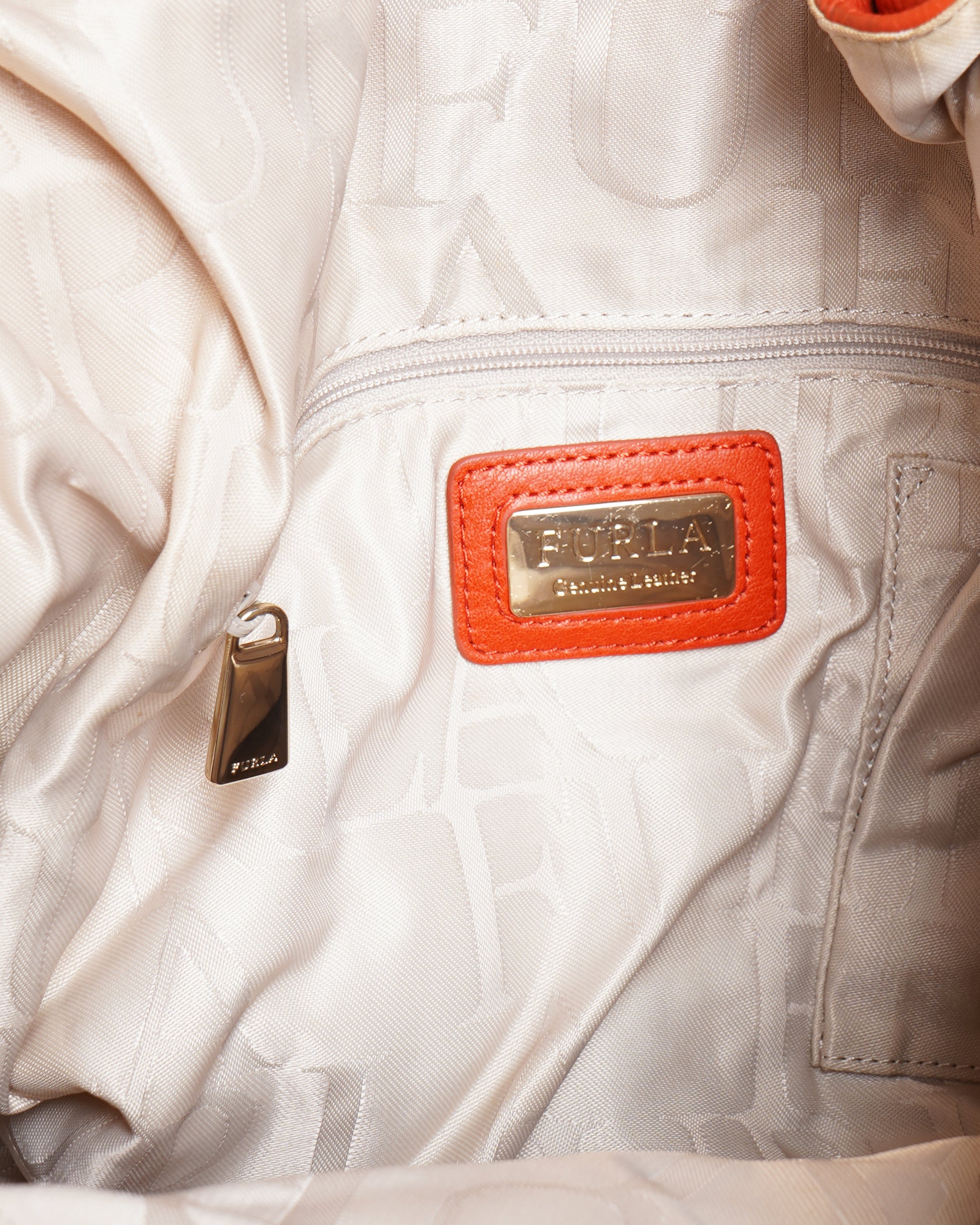 Furla
orange leather hobo bag