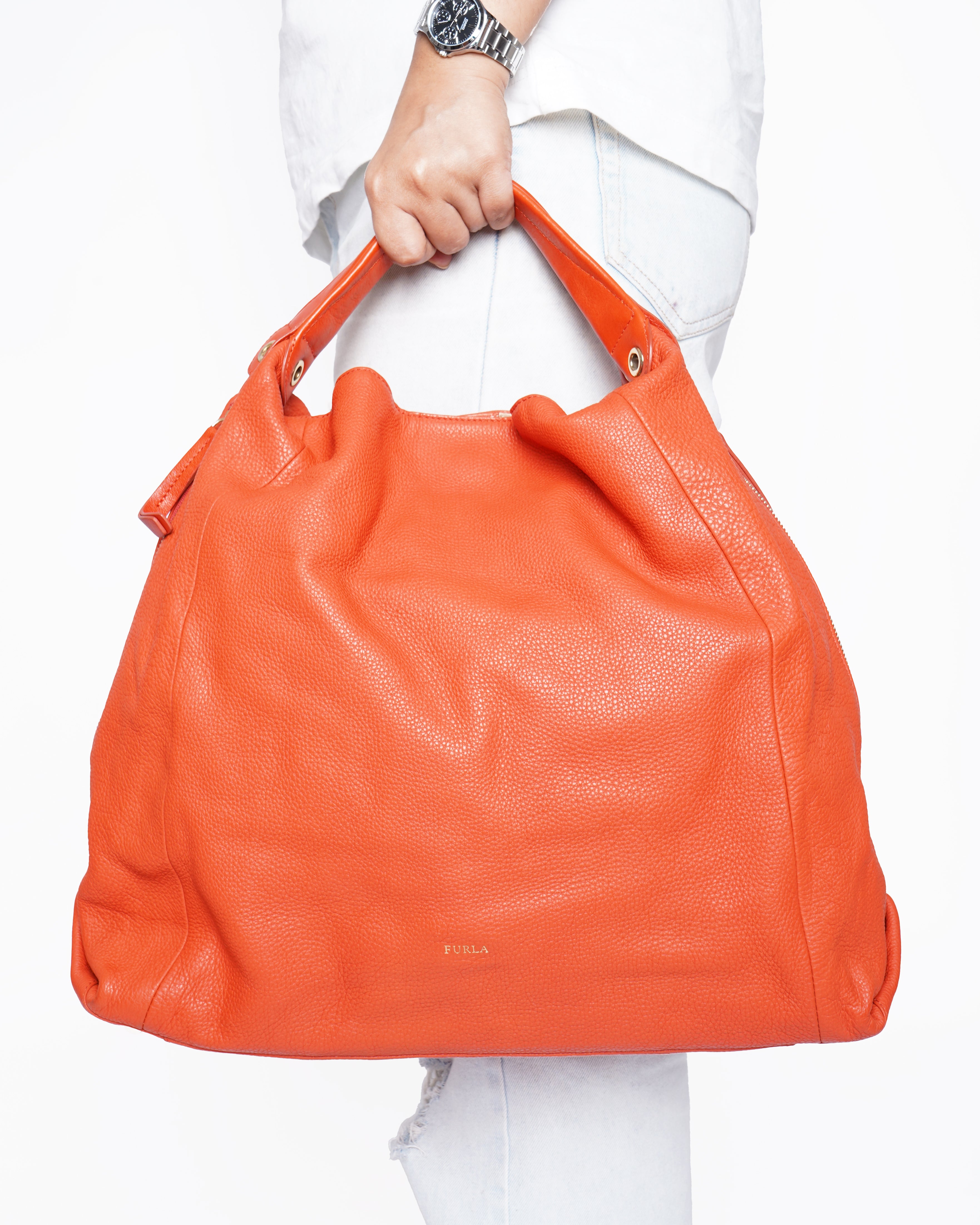 Furla
orange leather hobo bag