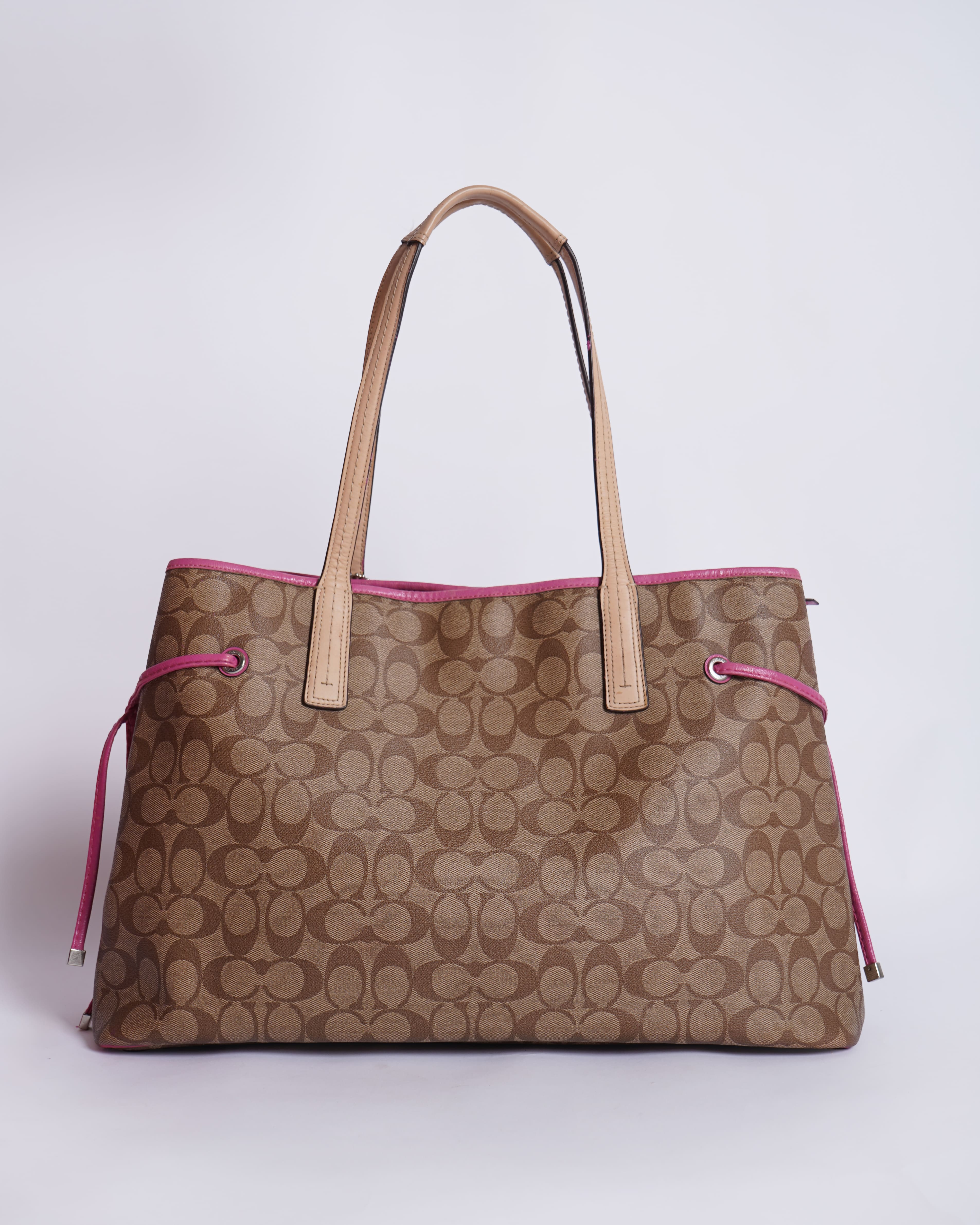 Coach Beige/Pink Signture Coated Canvas and
Leather Striped Drawstring Tote