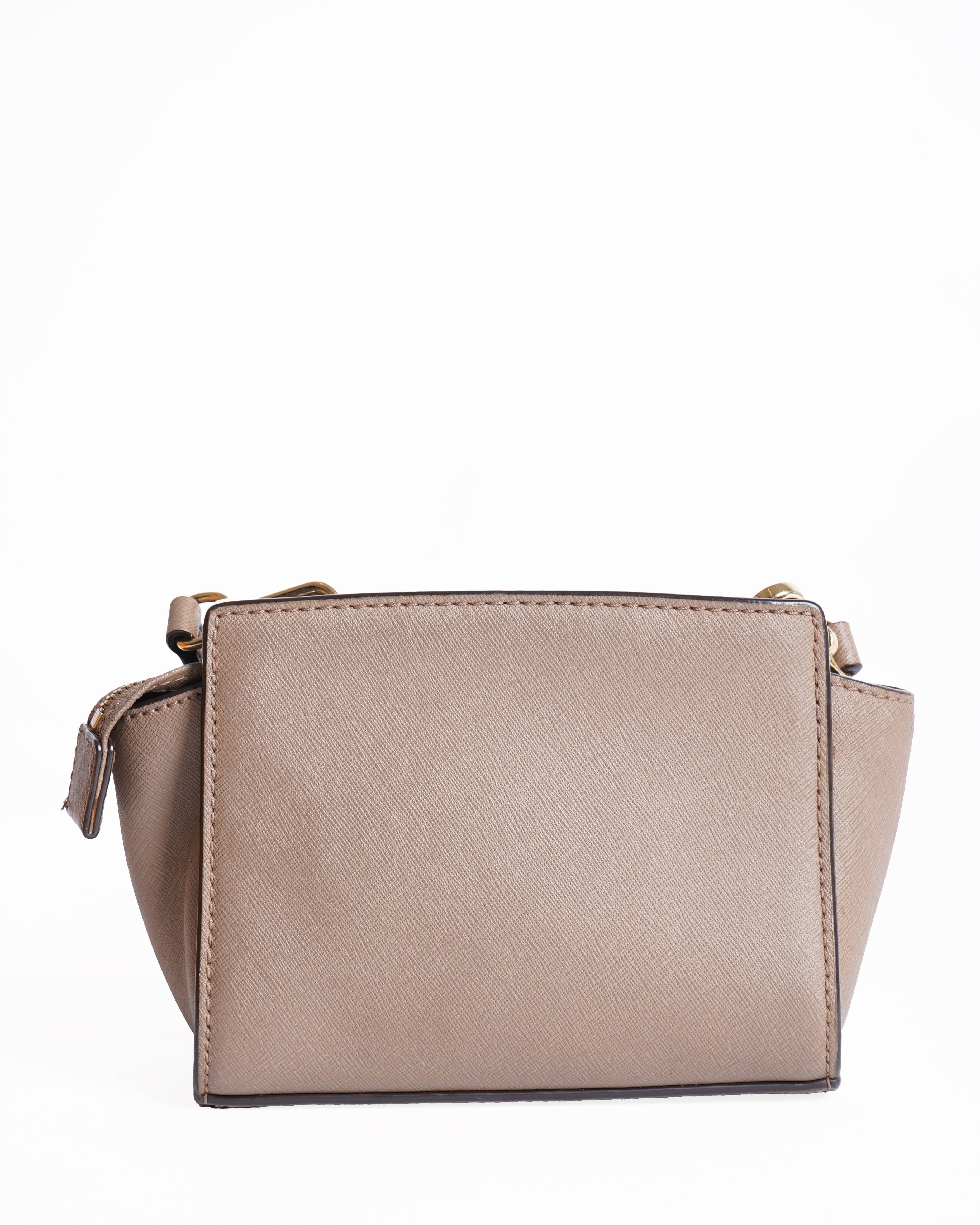 Michael kors 
Leather Mini Selma Crossbody bag