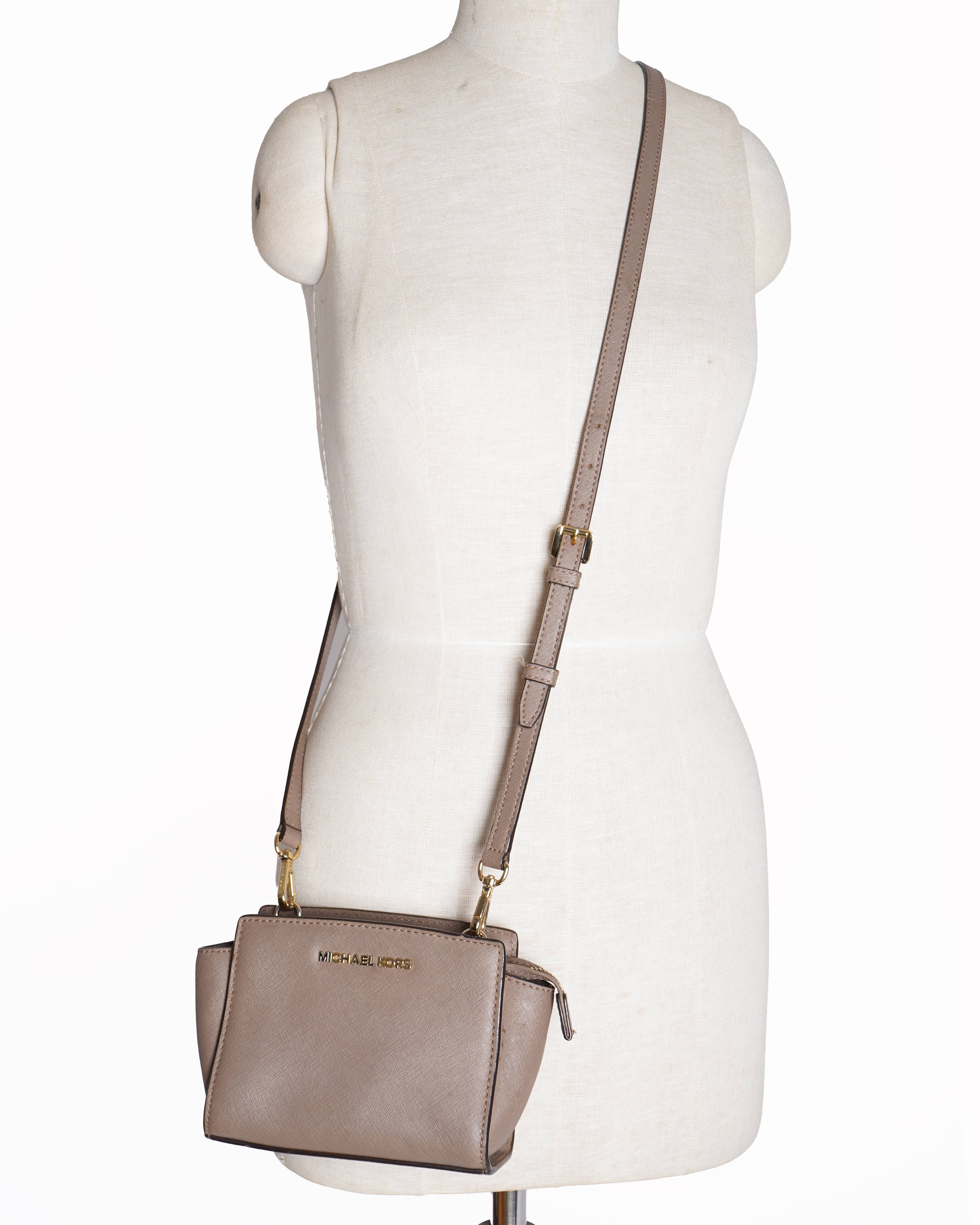 Michael kors 
Leather Mini Selma Crossbody bag