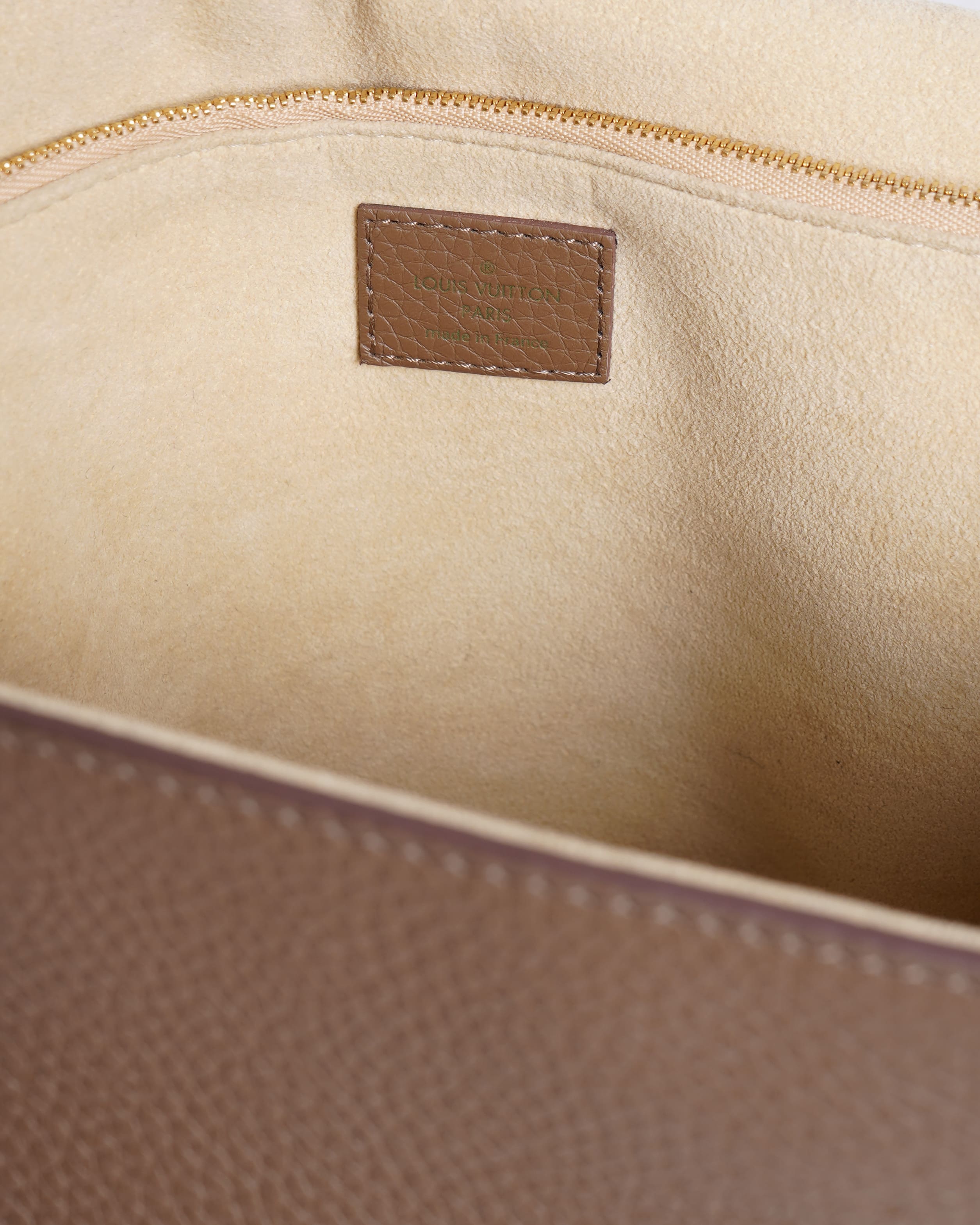 Louis Vuitton Volta Top Handle Bag In Beige