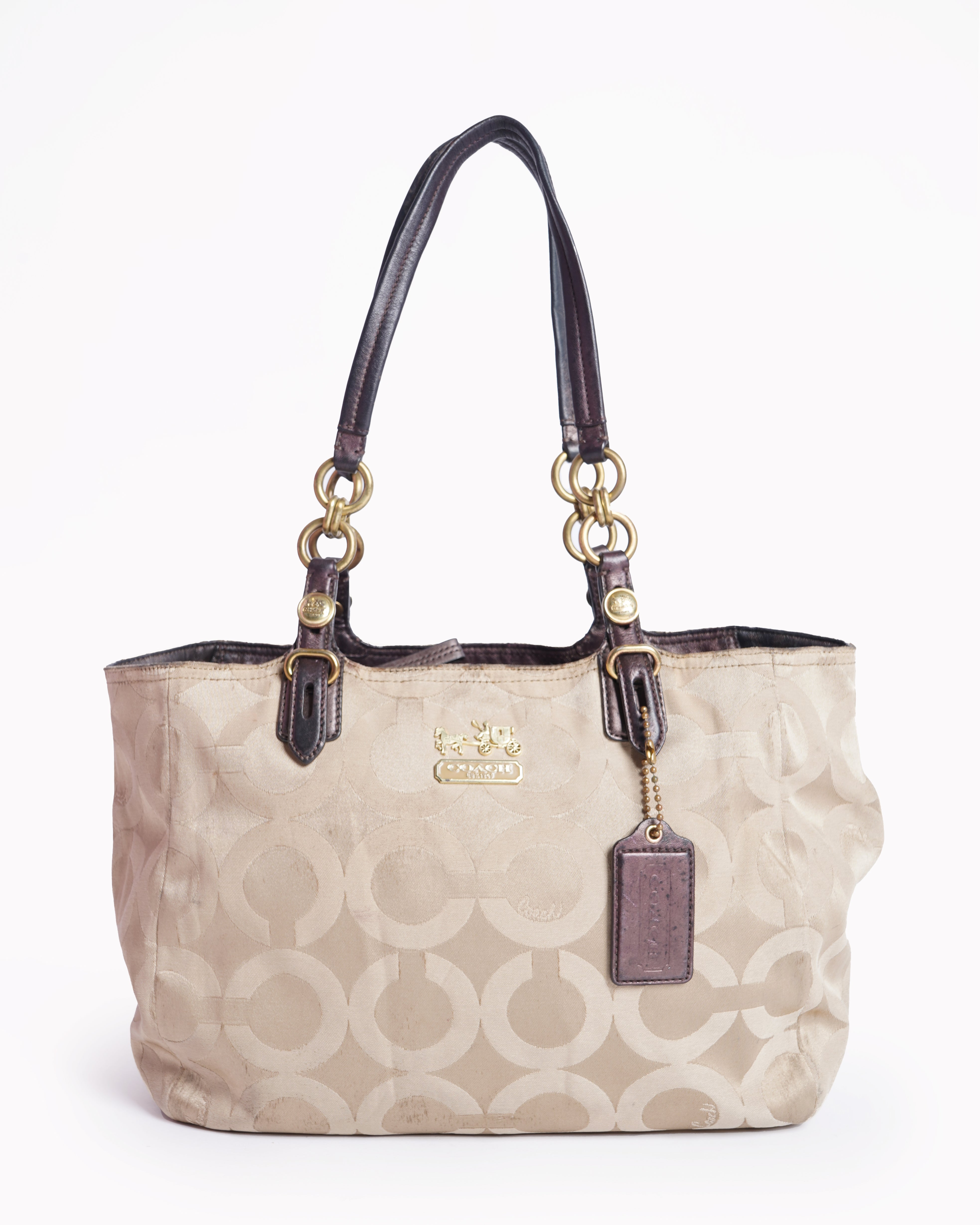 Coach 
Op art fabric signature leather bag
