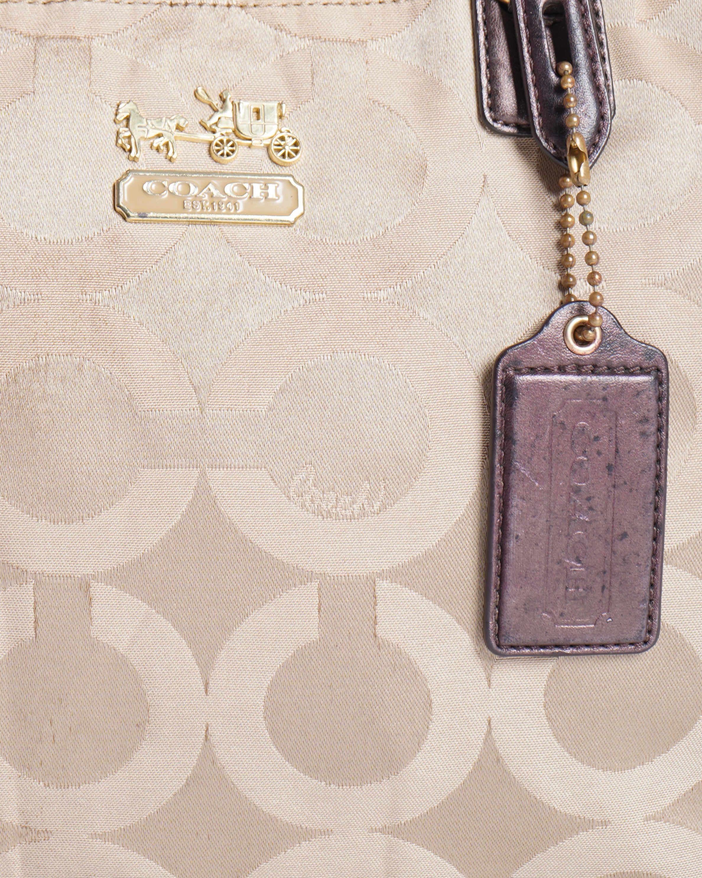 Coach 
Op art fabric signature leather bag