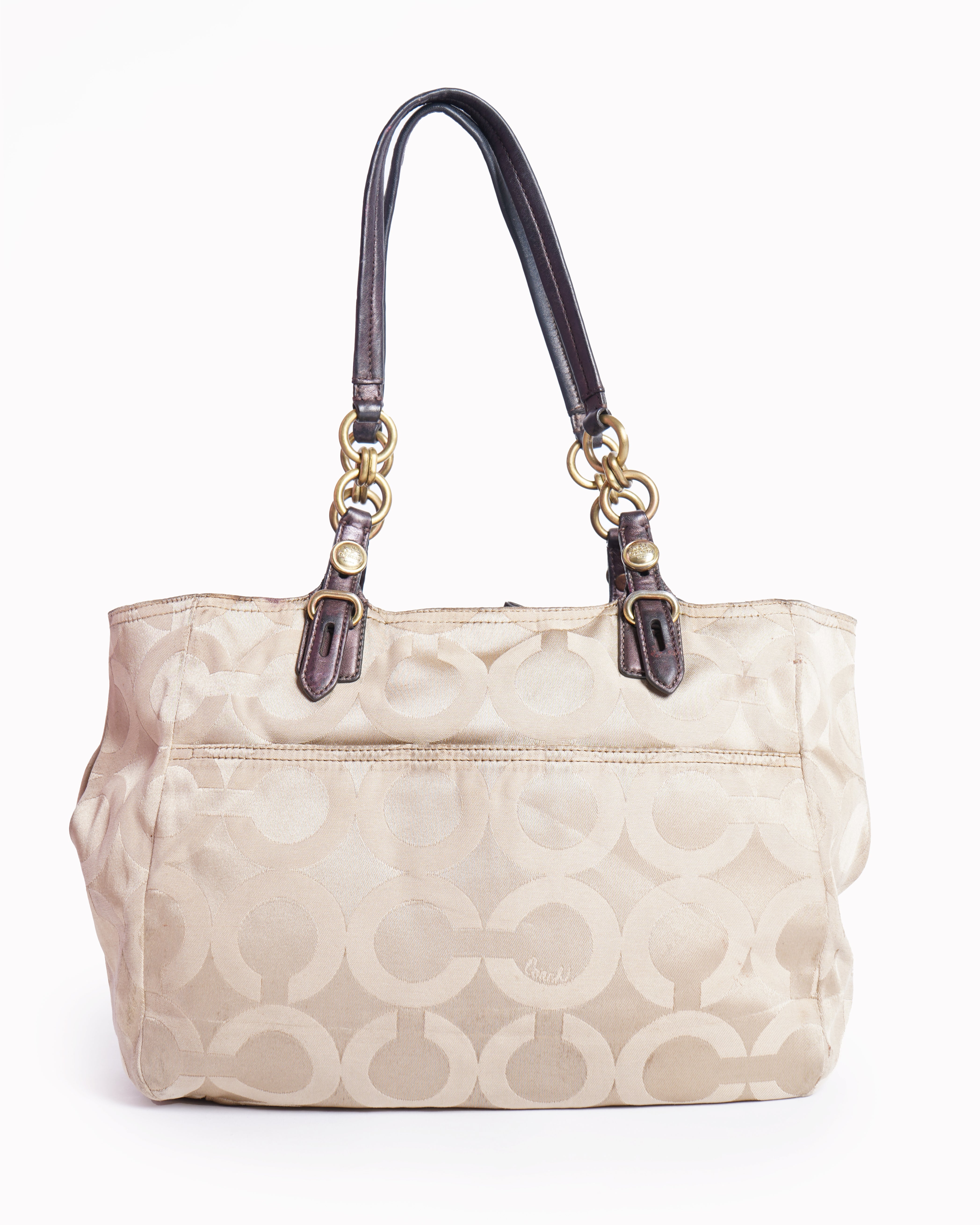 Coach 
Op art fabric signature leather bag