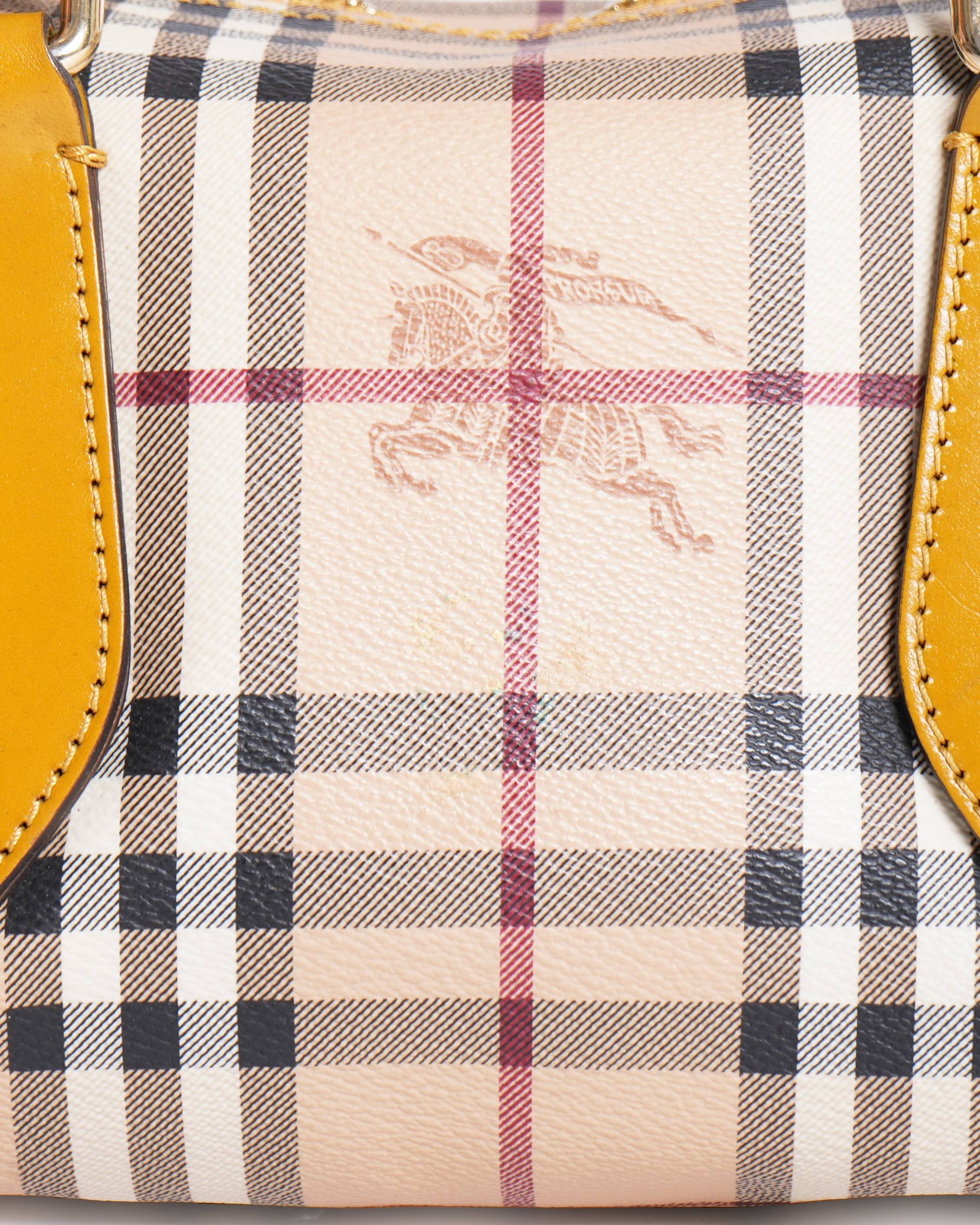 Burberry
Beige/Mustard Haymarket Check Mini HandBag
