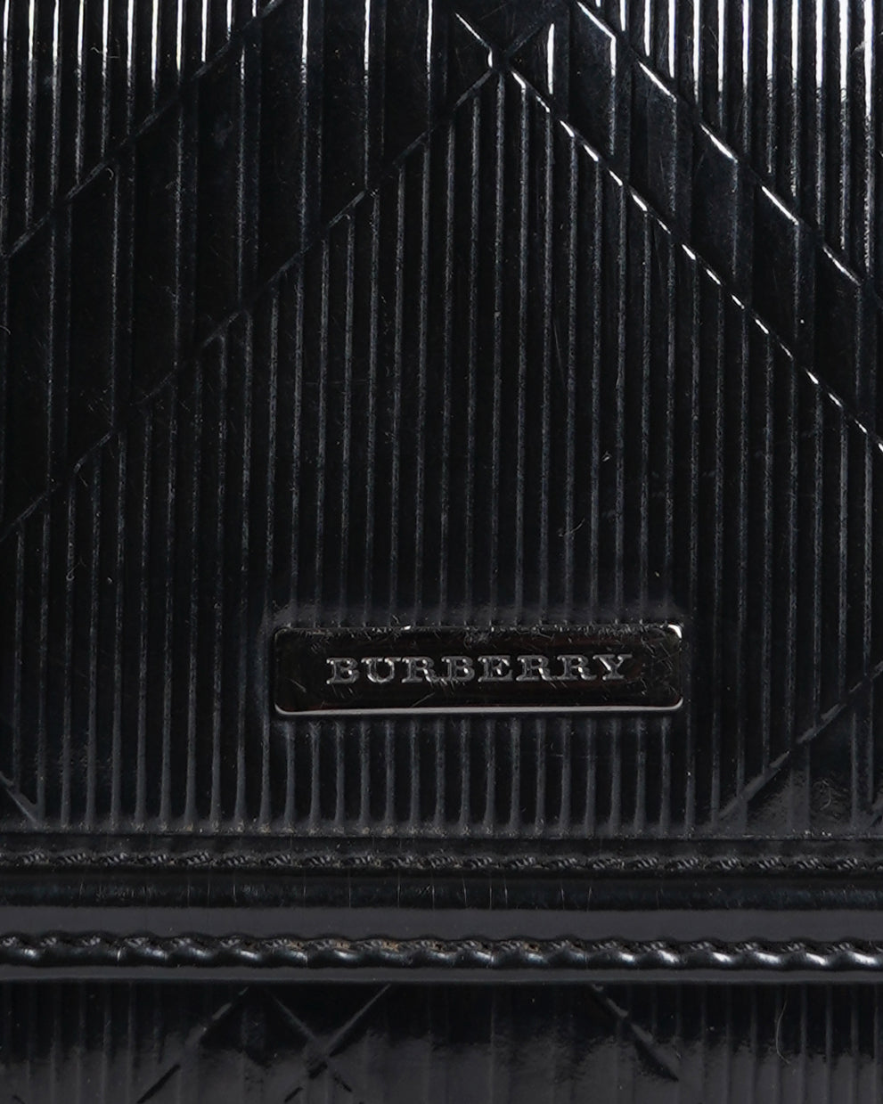 Burberry
London plaid pattern zip around clutch wallet