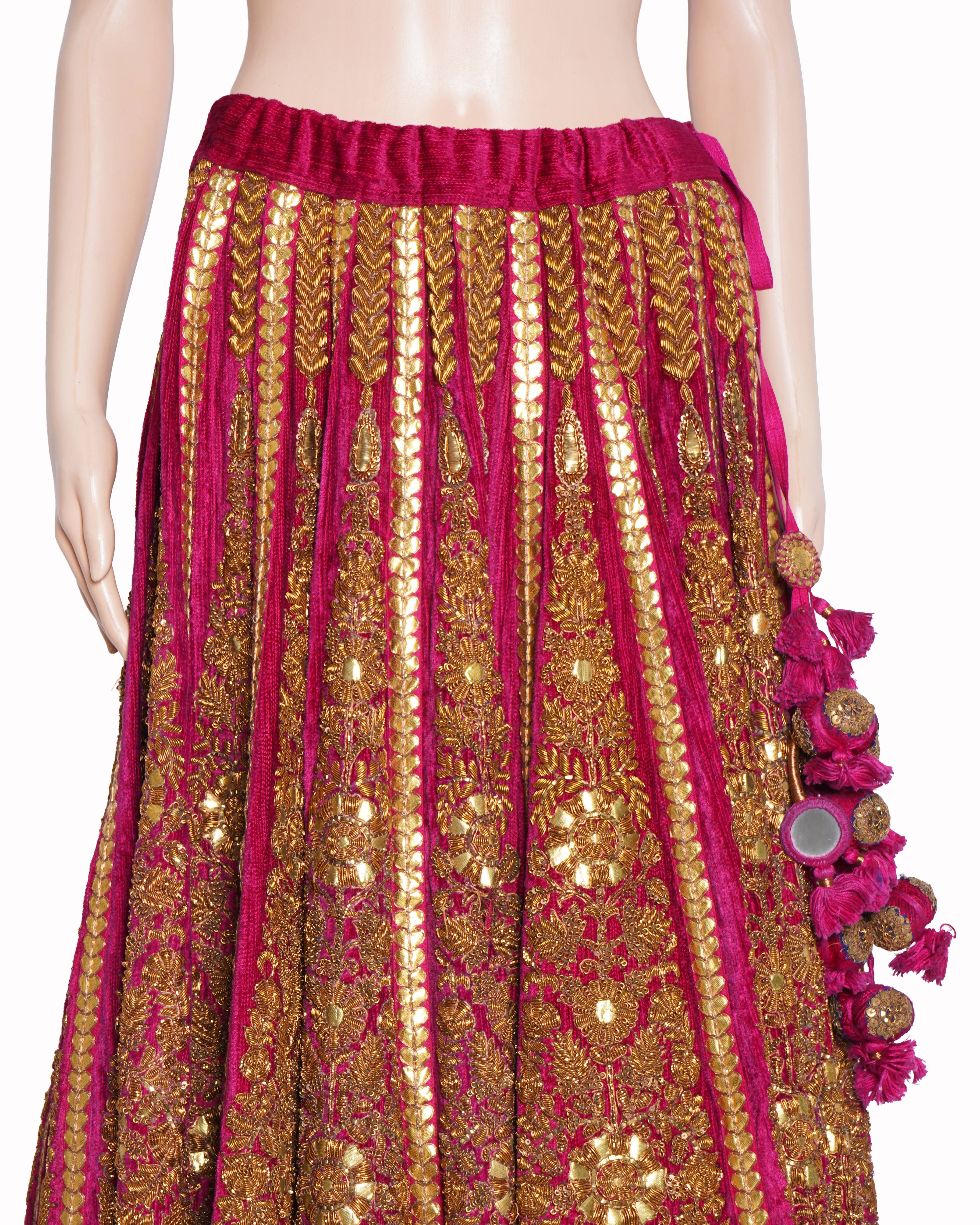 Sabyasachi magenta pink and gold embroidered lehenga