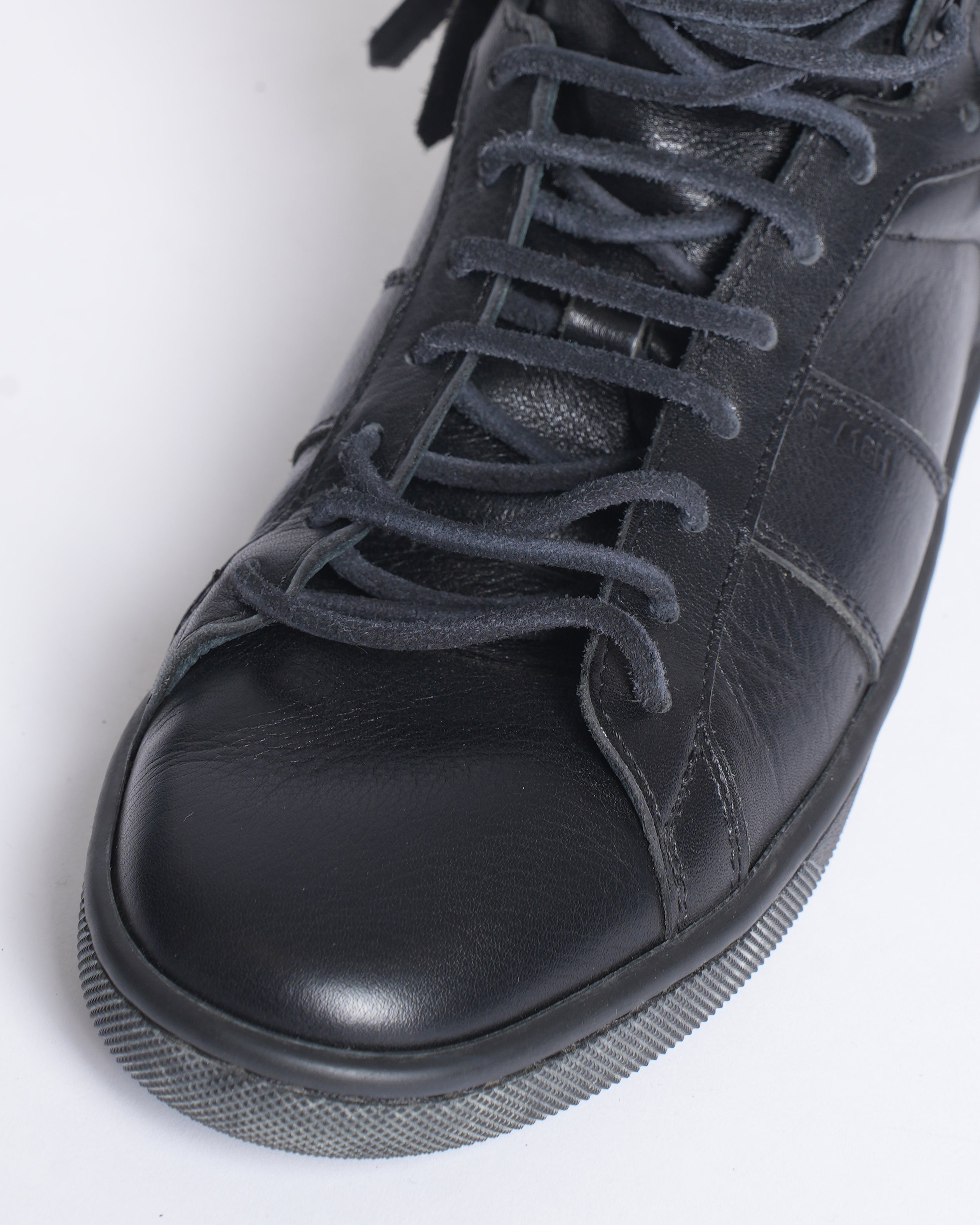 Saint Laurent black fringe leather sneakers