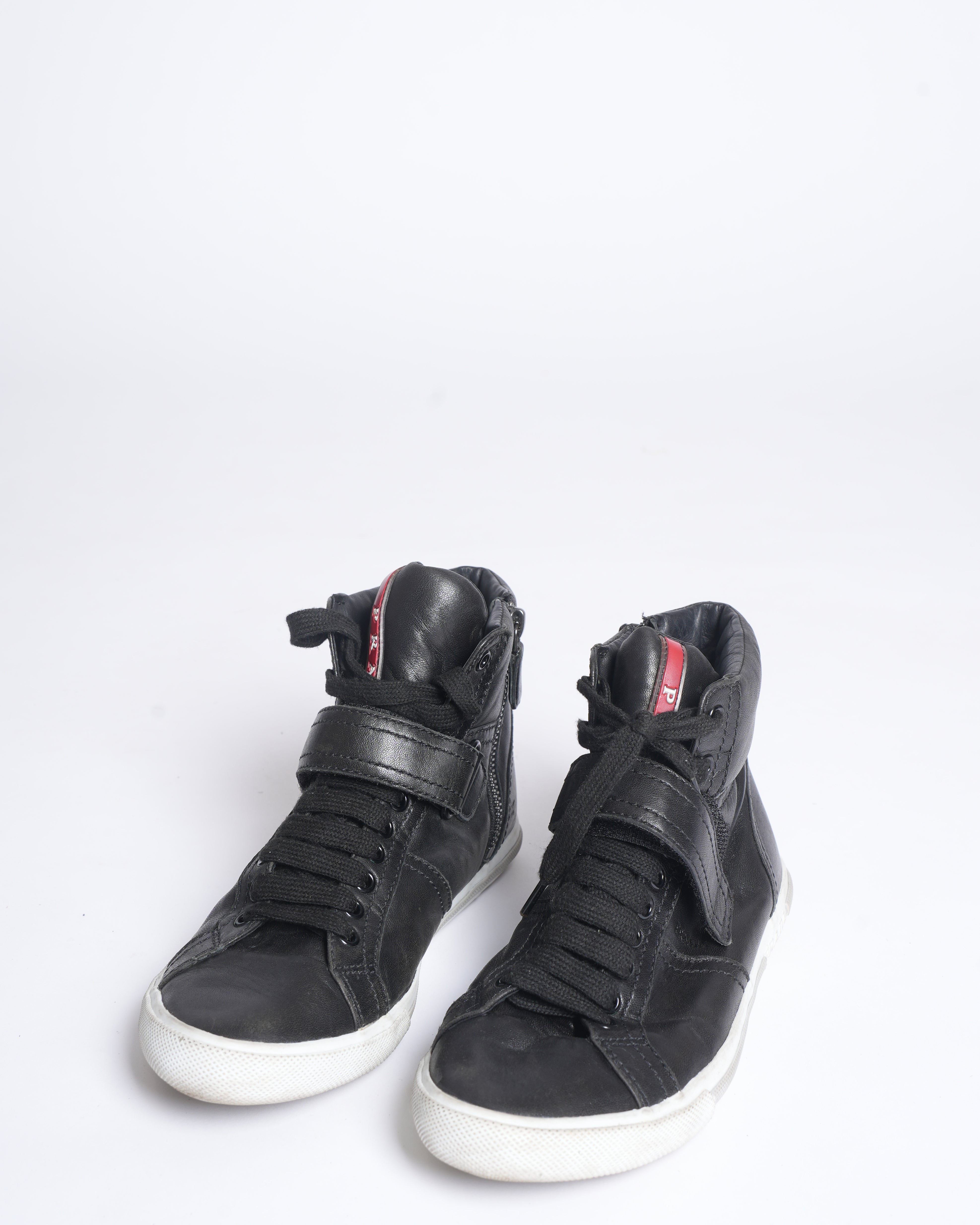Prada high top black leather sneakers