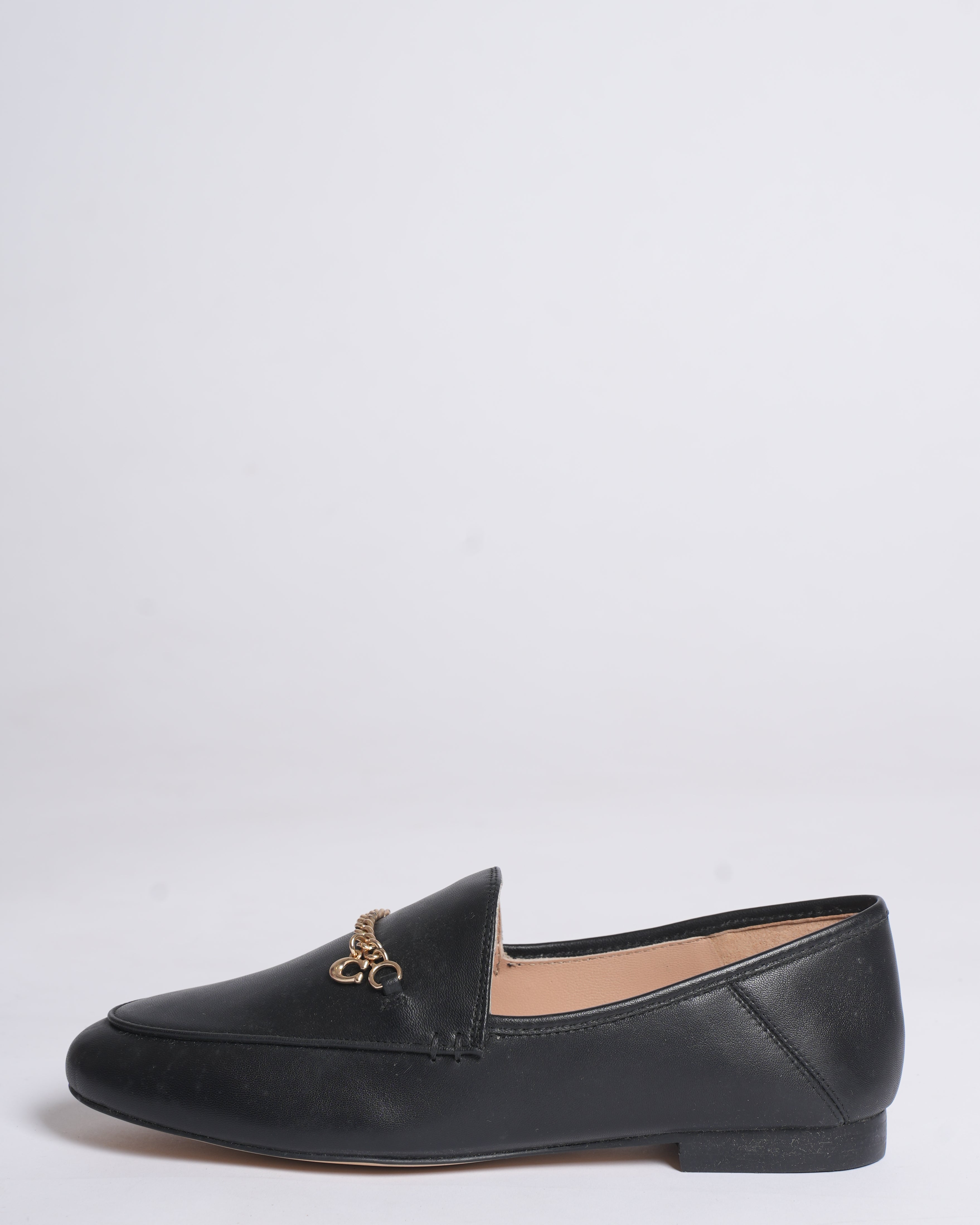 New Coach Hanna loafers in black with a gold-tone chain
