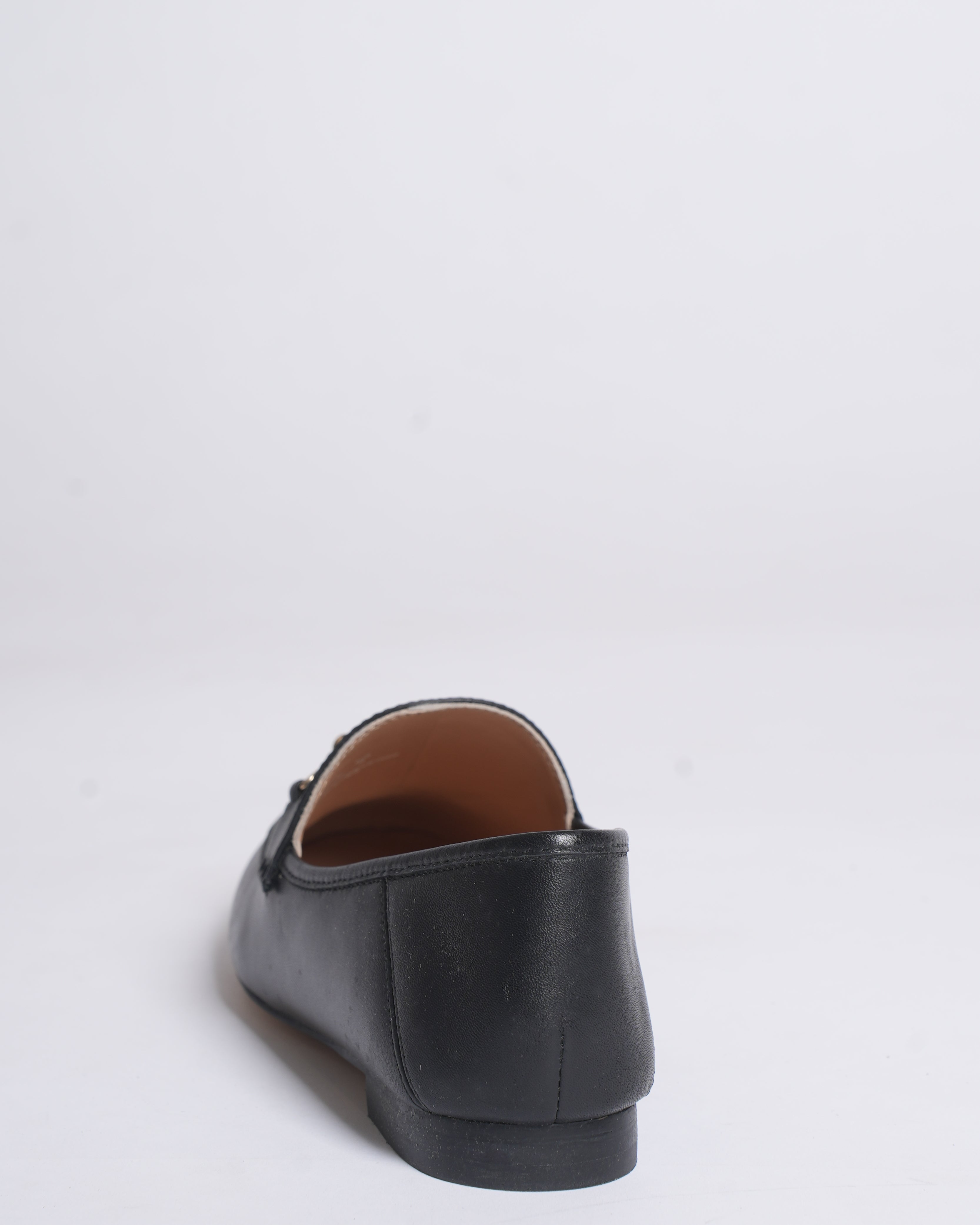 New Coach Hanna loafers in black with a gold-tone chain