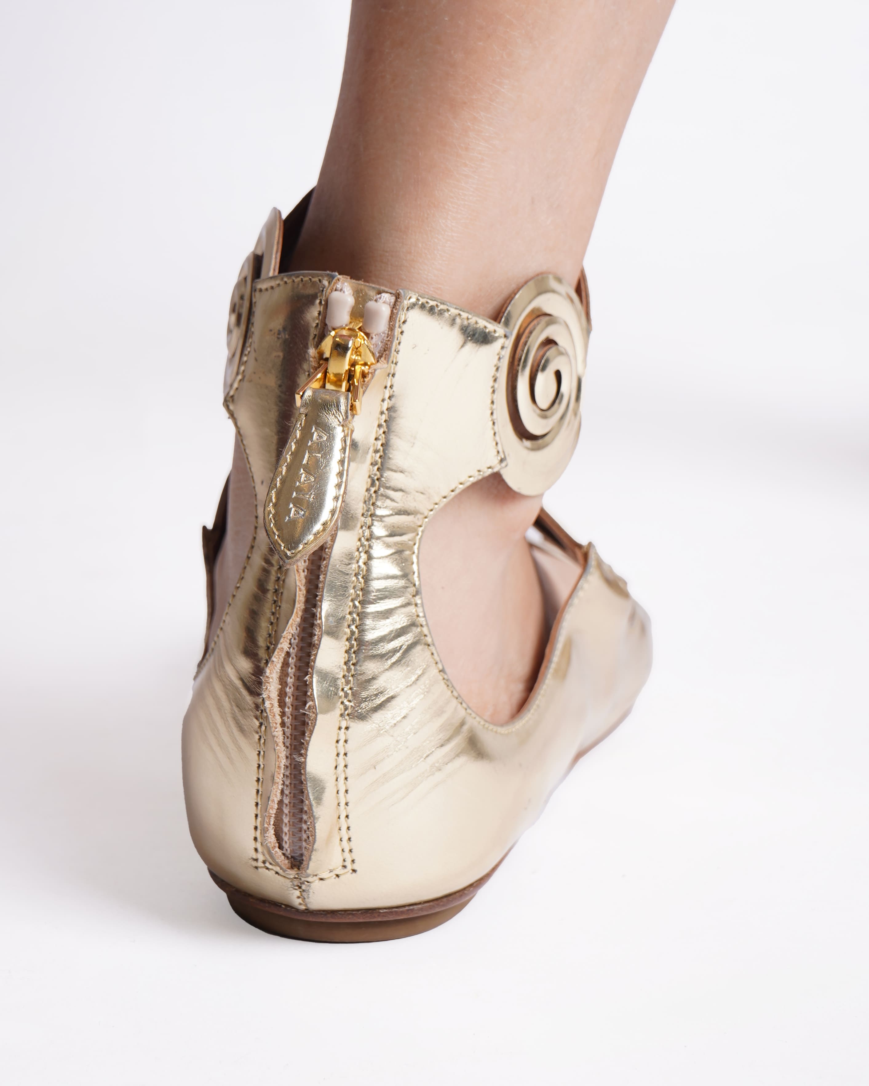 Alaia back zipped rhodium flat sandals