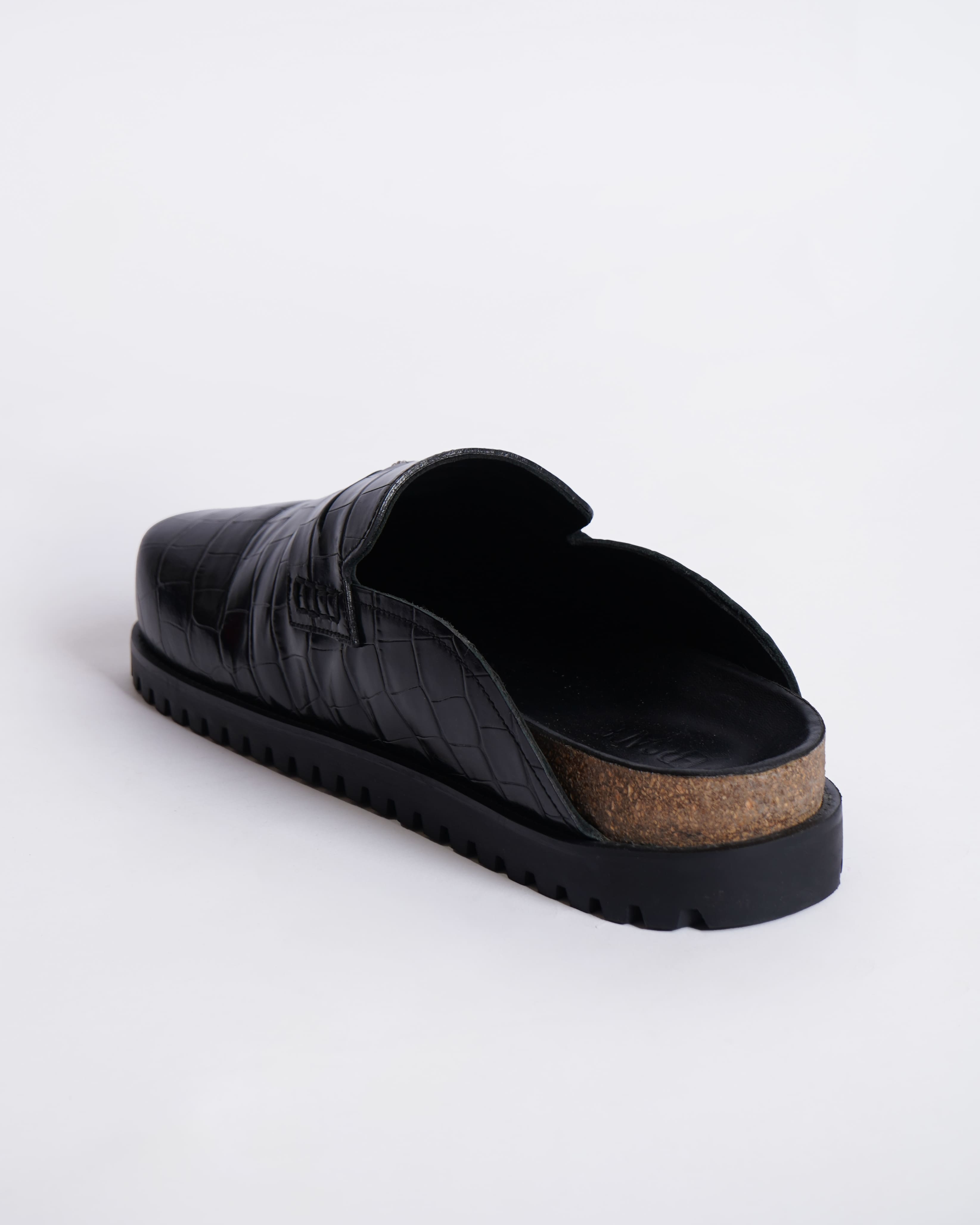 New Versace
Medusa crocodile-embossed slides