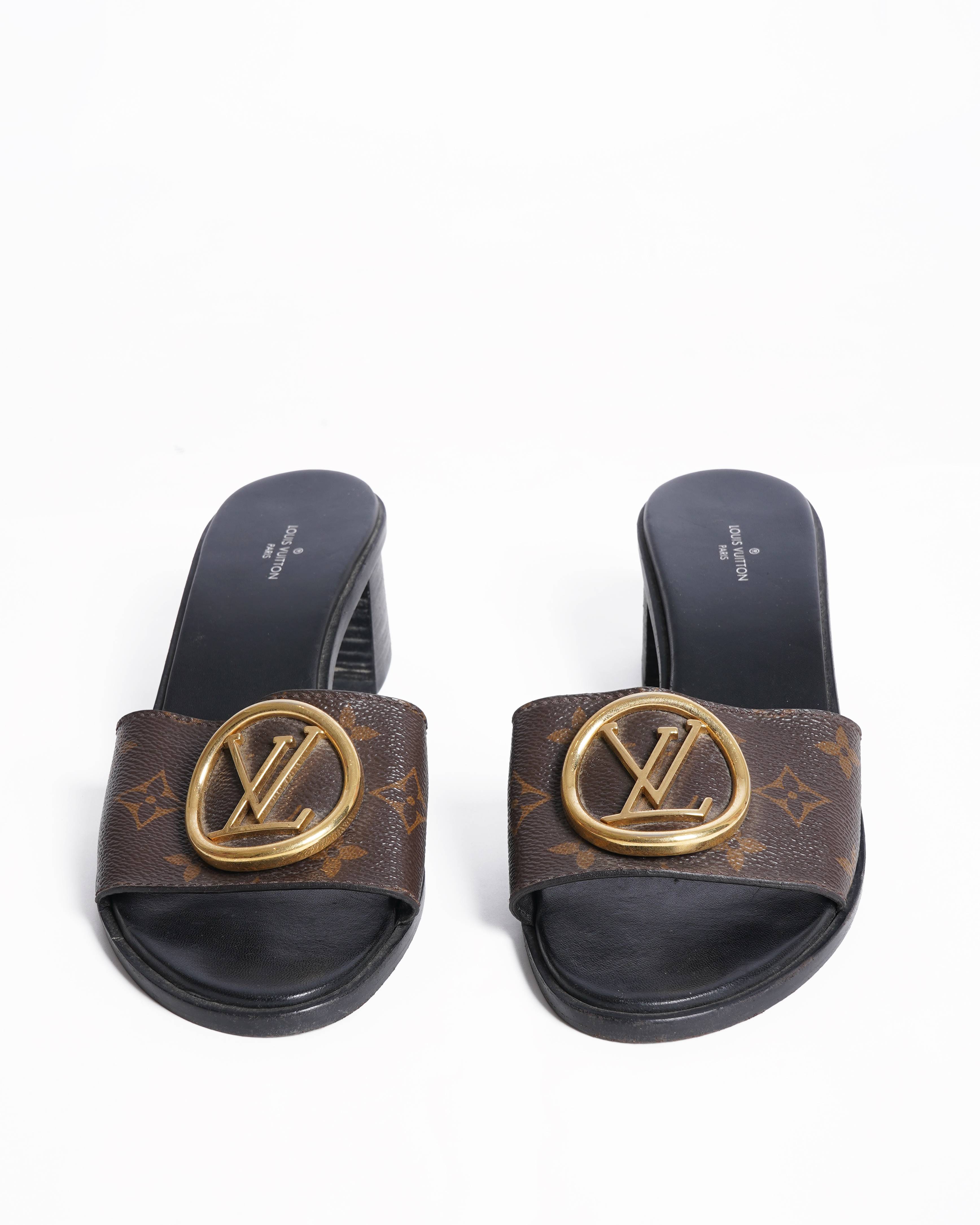 Louis Vuitton
Lock it leather mules