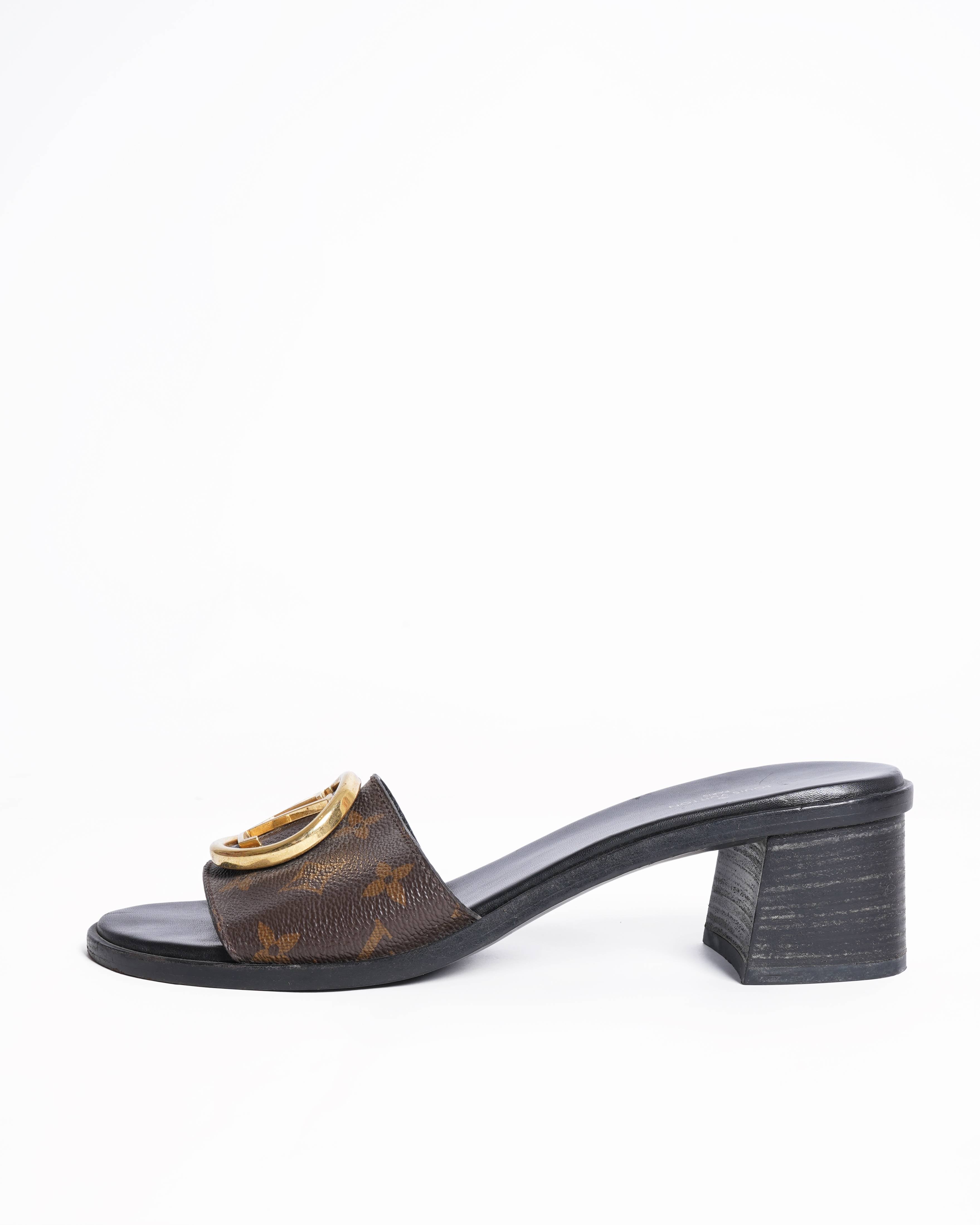 Louis Vuitton
Lock it leather mules