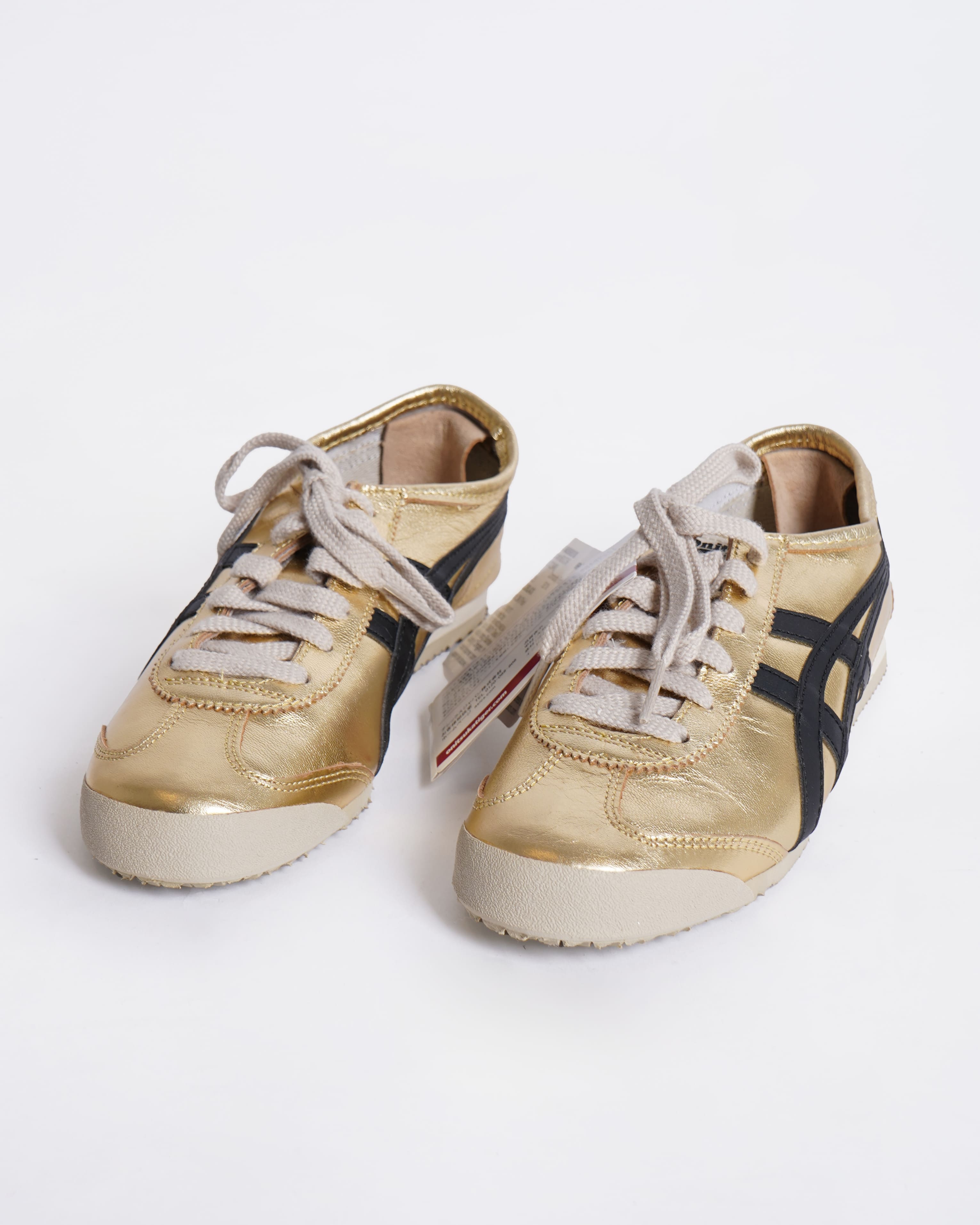Onitsuka gold and black sneakers