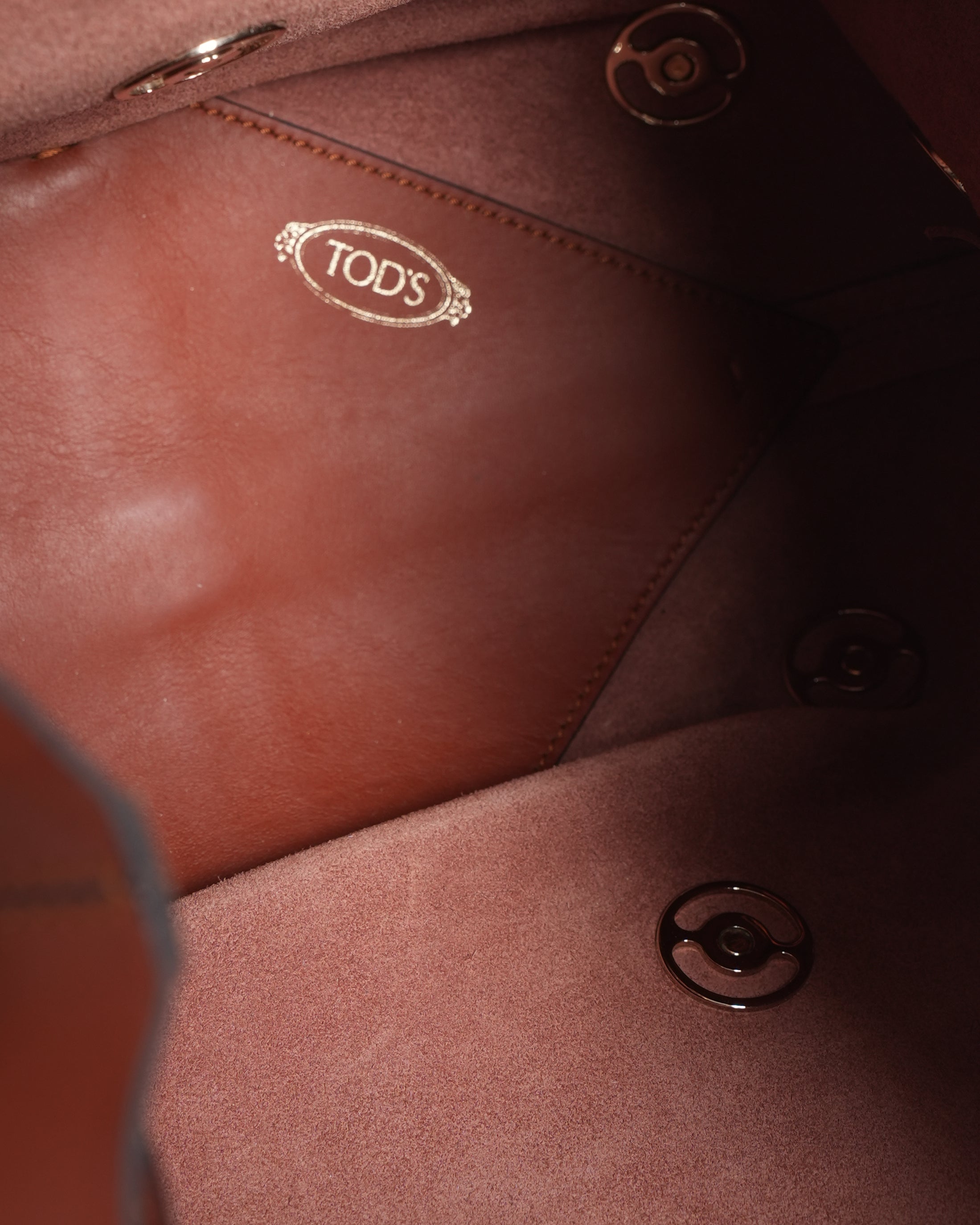 Tod's brown leather metallic stud bucket bag