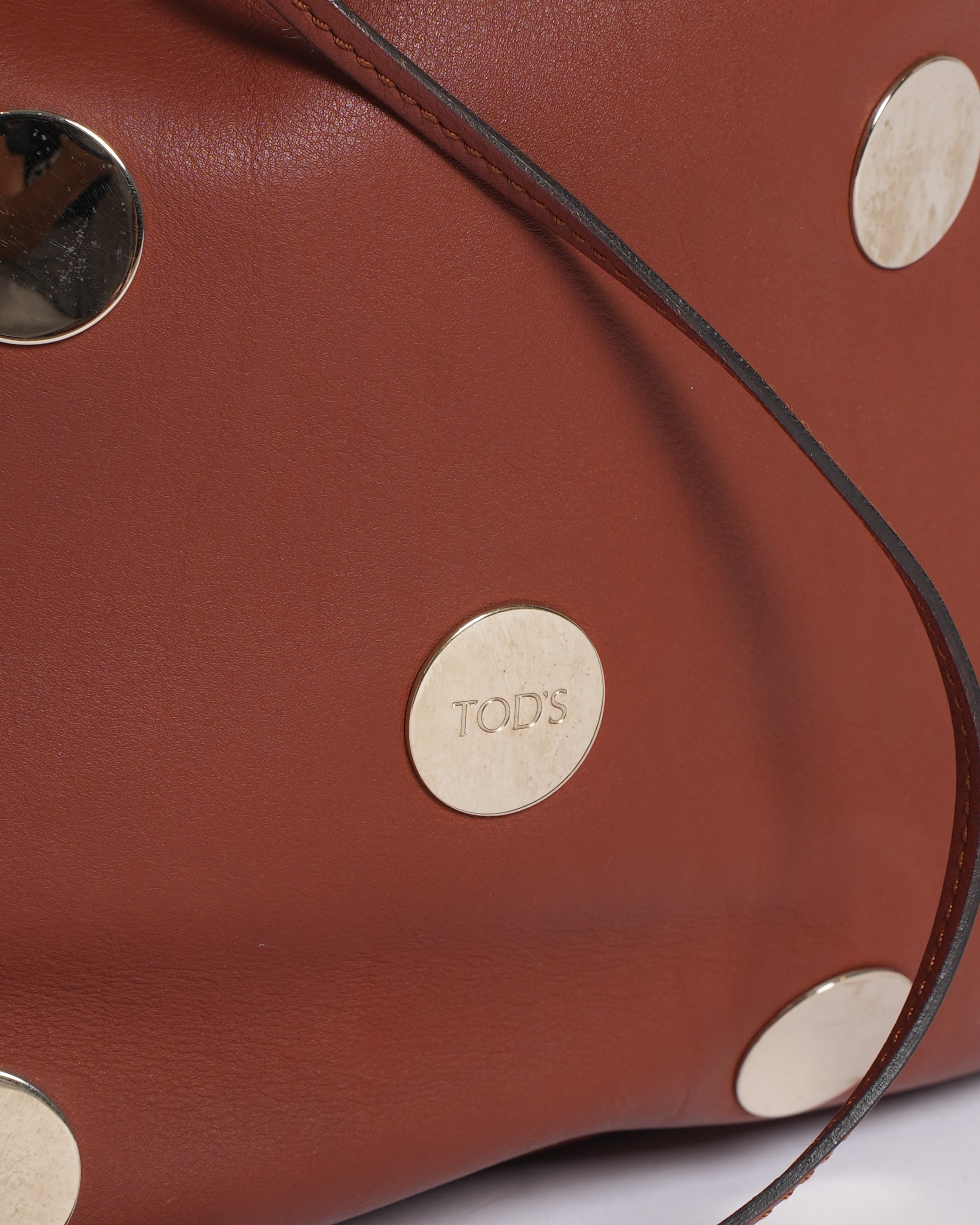 Tod's brown leather metallic stud bucket bag