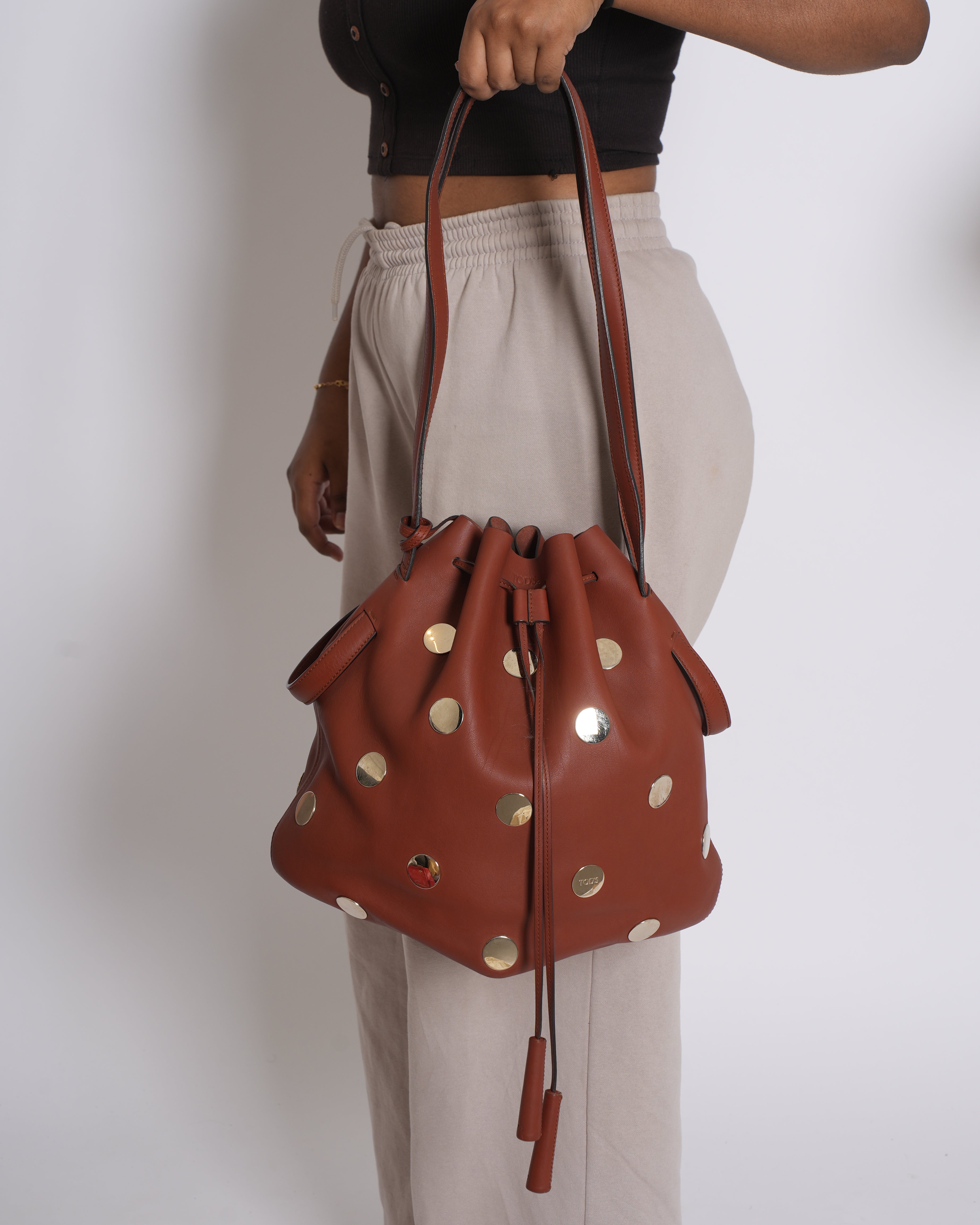 Tod's brown leather metallic stud bucket bag