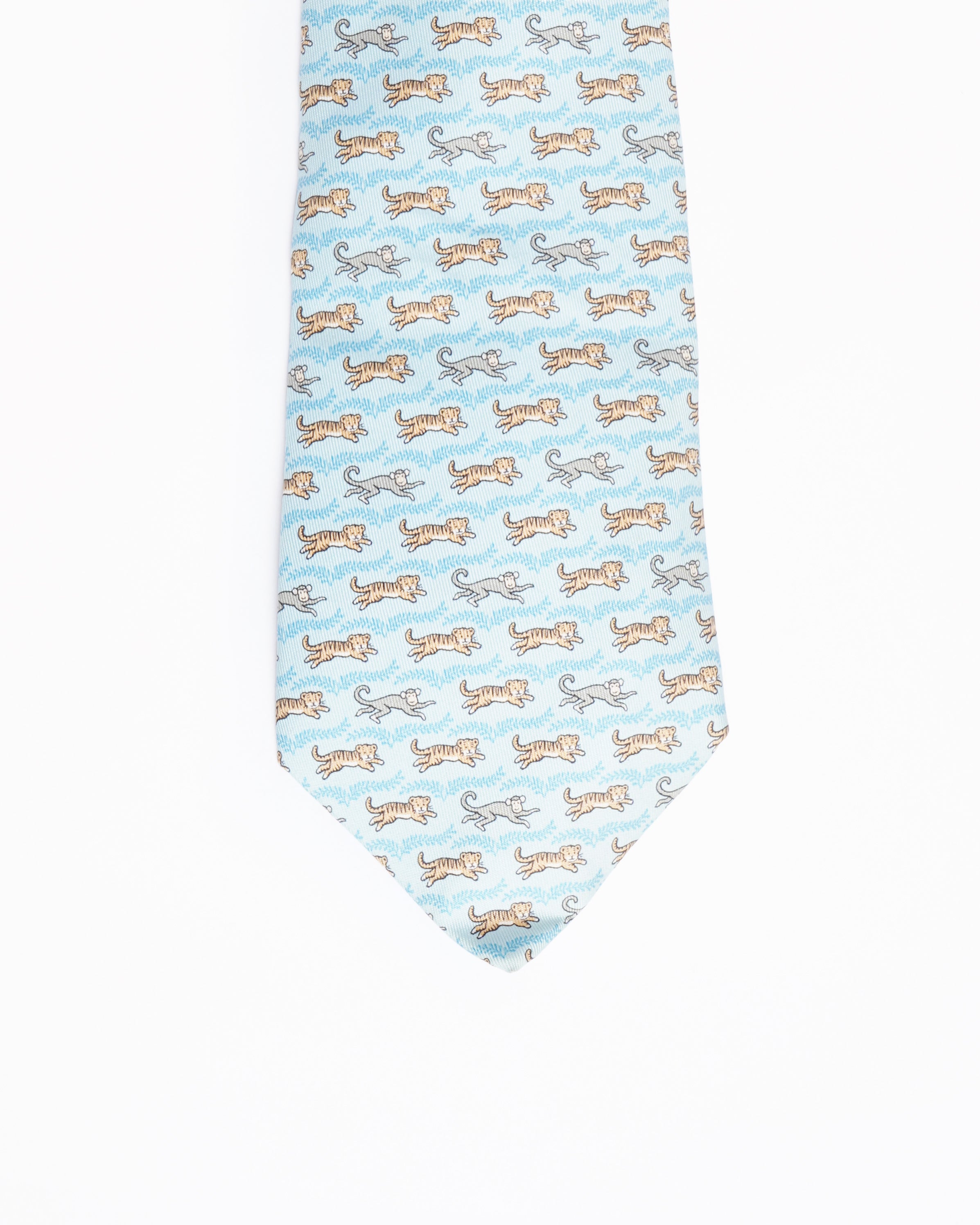 Hermes light blue silk tie with tiger and monkey print