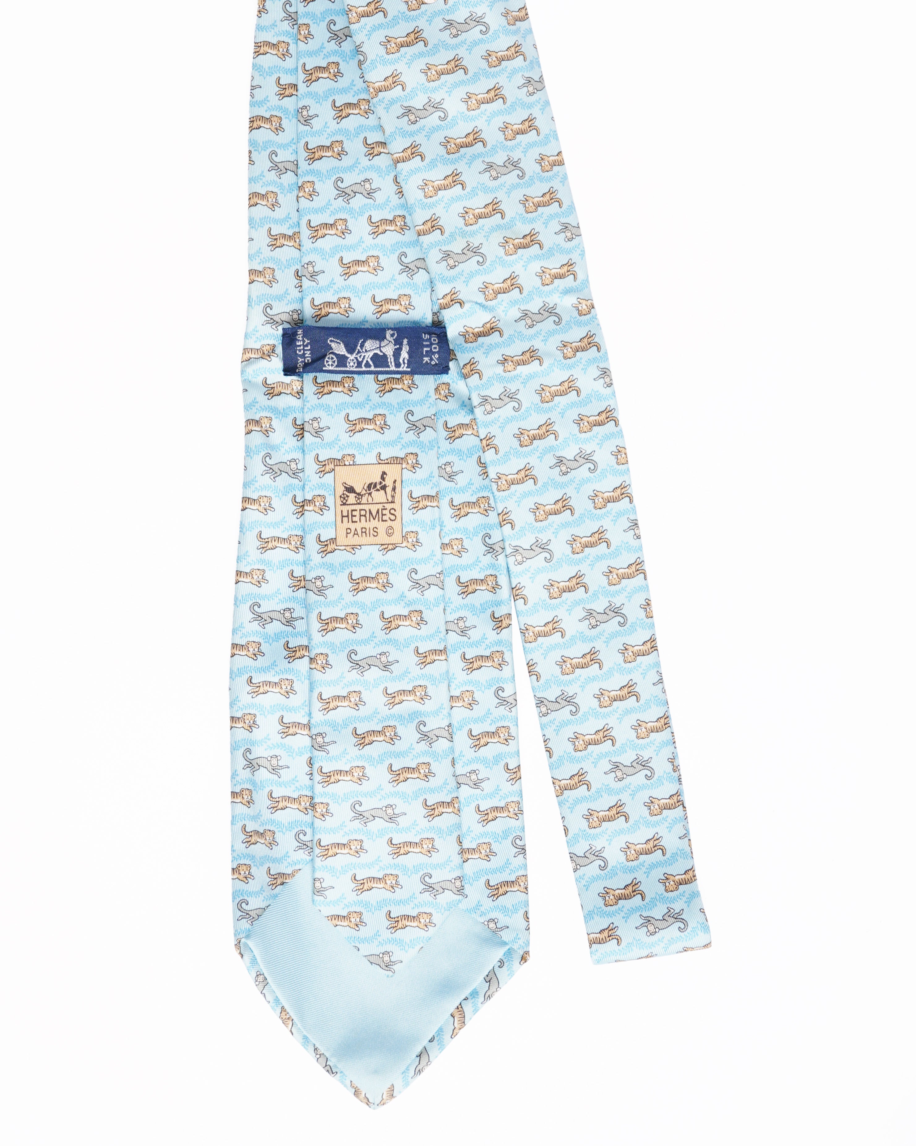 Hermes light blue silk tie with tiger and monkey print
