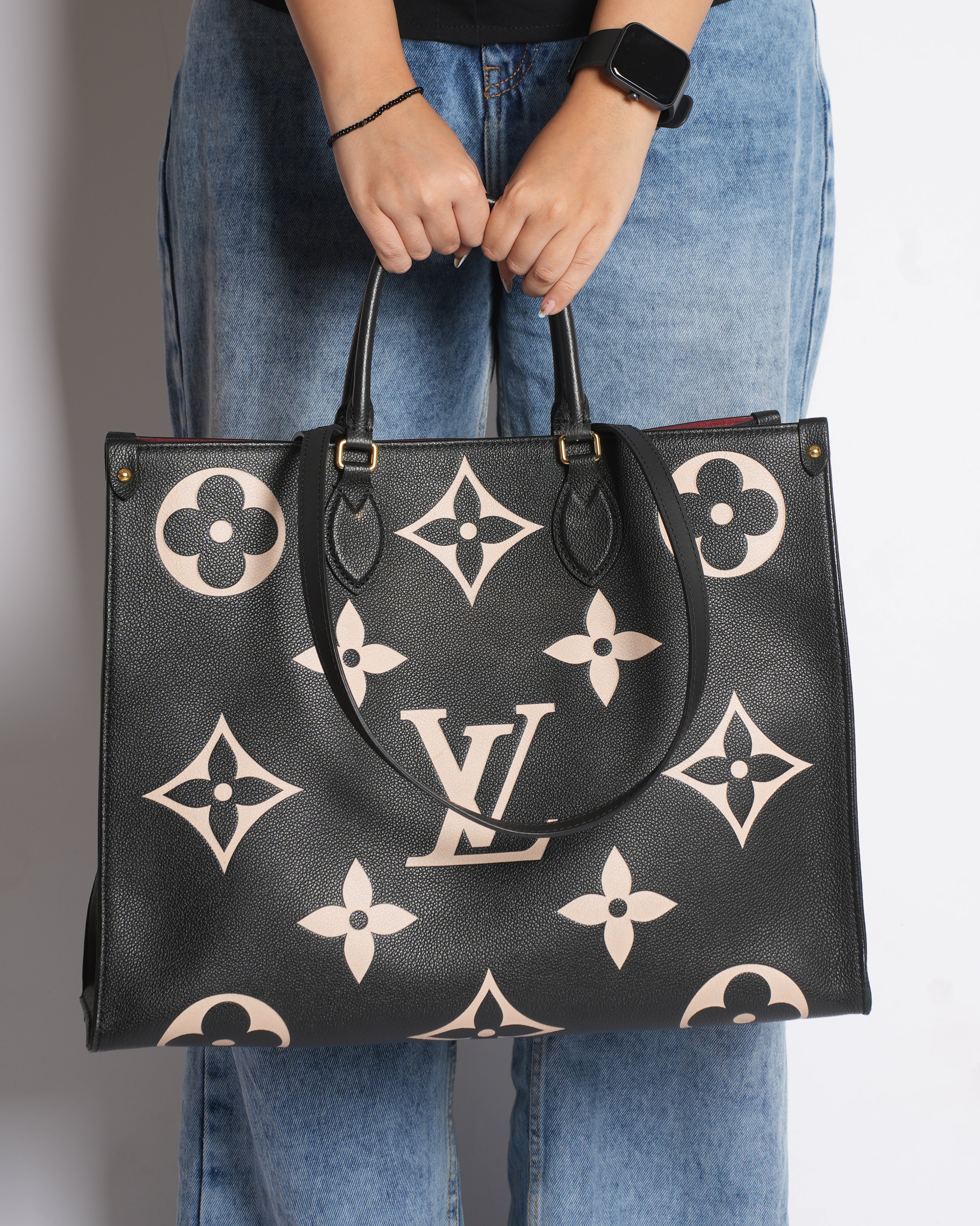 LV On The Go GM Bicolor Monogram Empreint Leather Bag