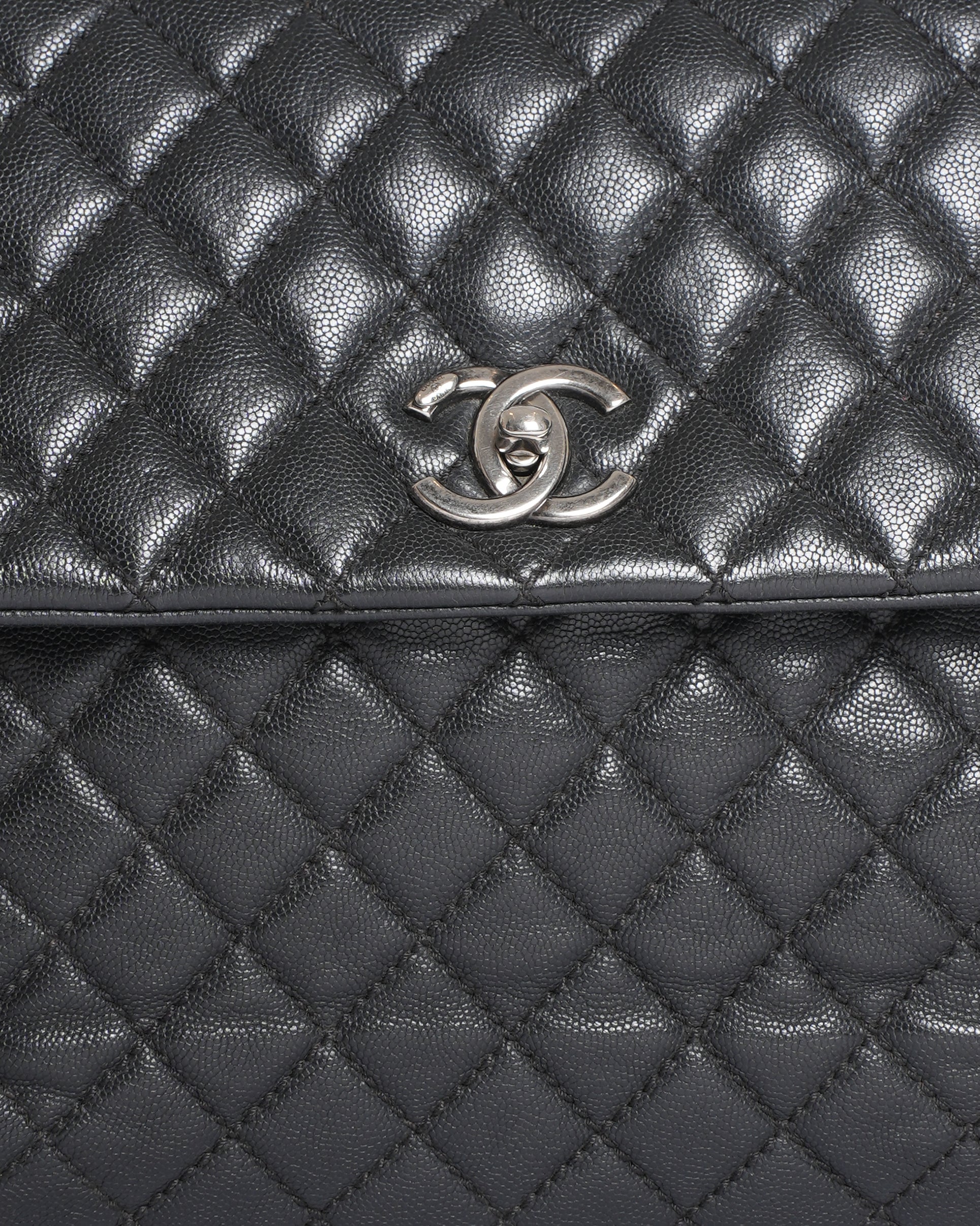 Chanel Quilted Caviar Coco Handle Bag in Black