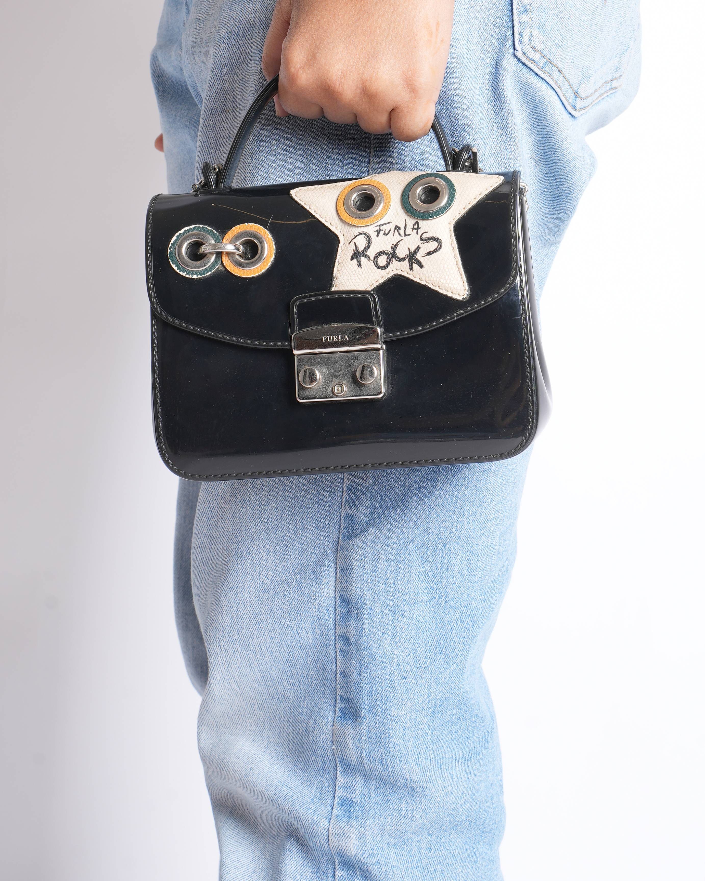 Furla mini metropolis top handle climbing crossbody bag