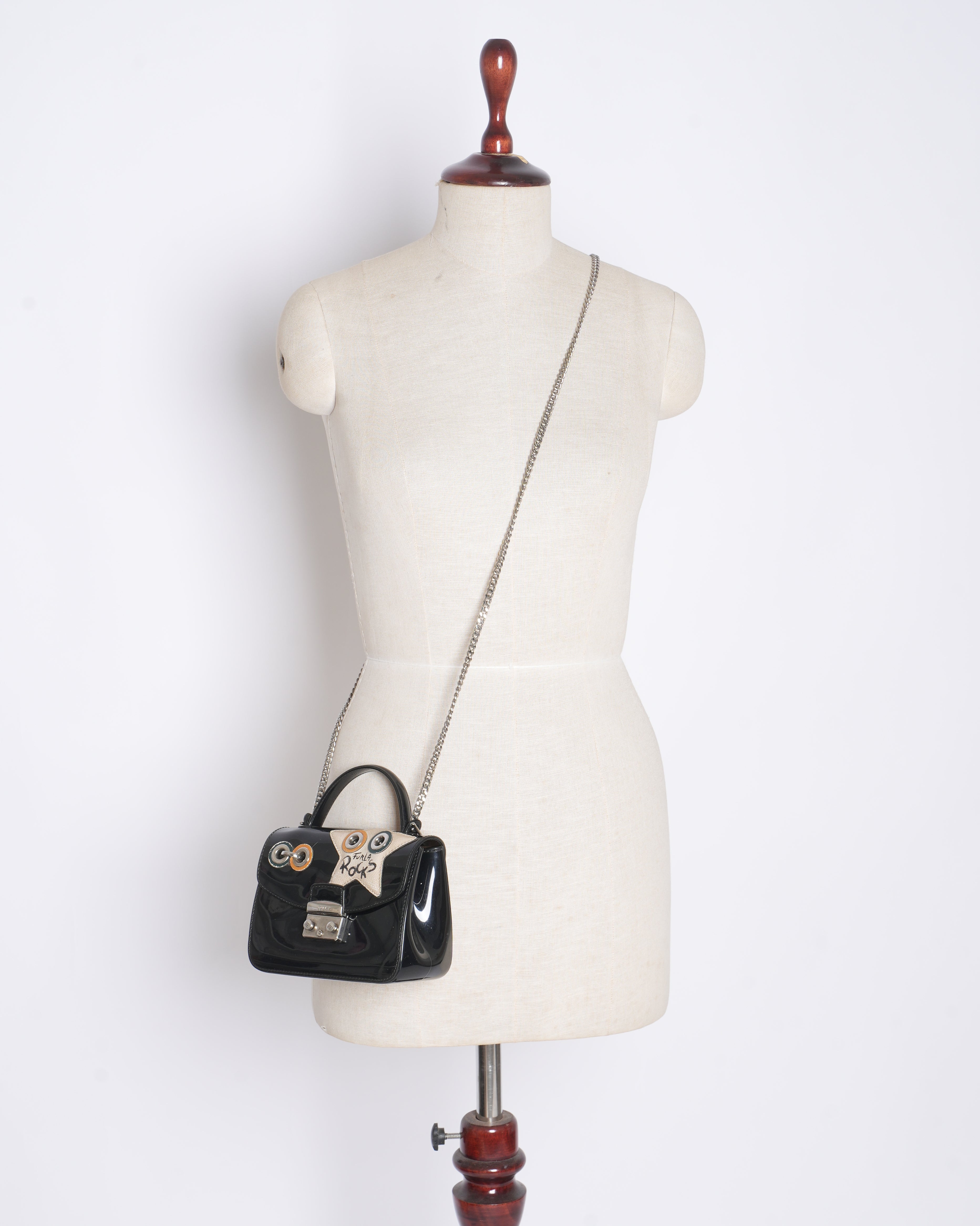 Furla mini metropolis top handle climbing crossbody bag