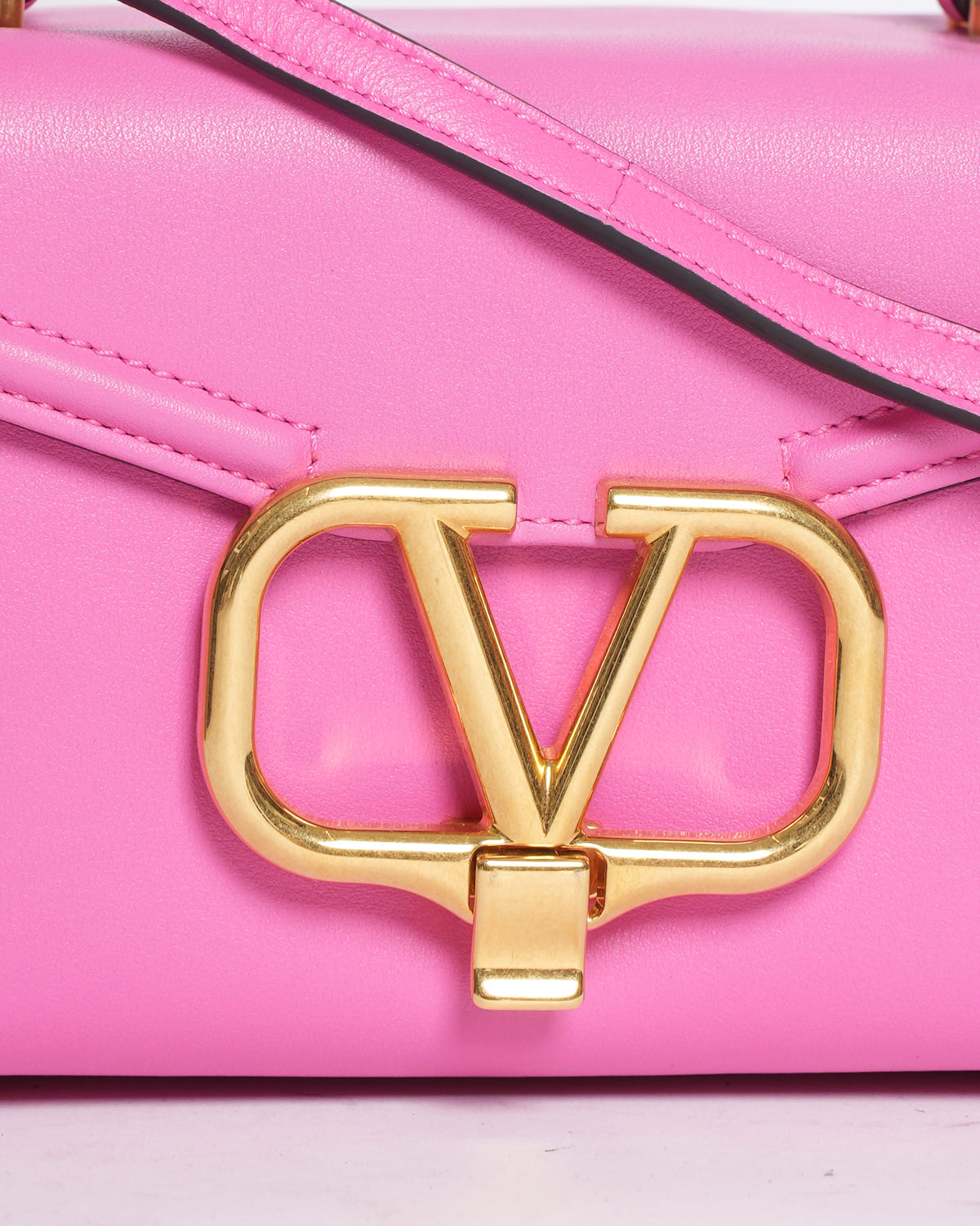 Valentino Garavani Bolso de Cuero V Logo Top Handle with Shoulder Strap in Pink
