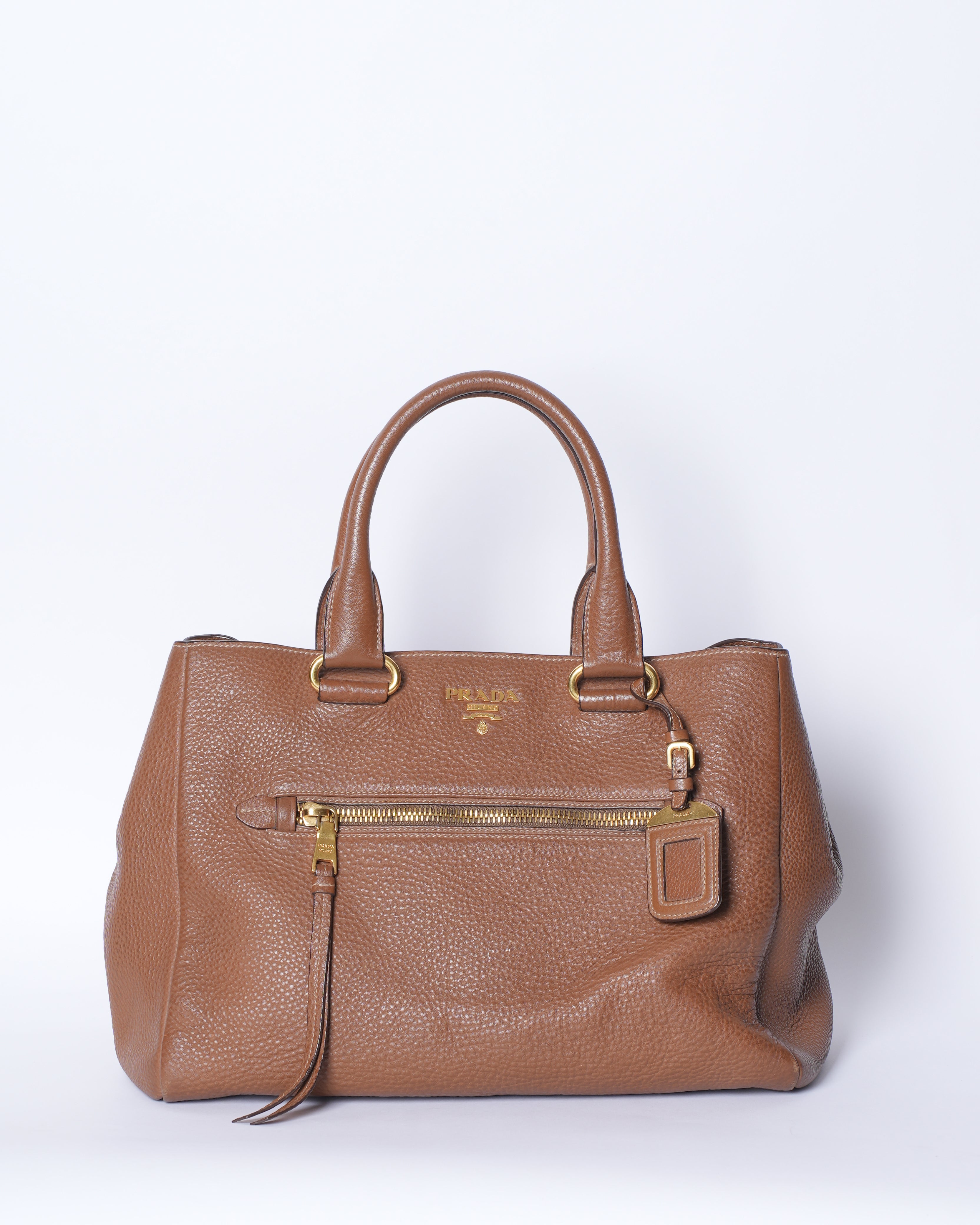 Prada Vitello Top Handle Bag In Brown