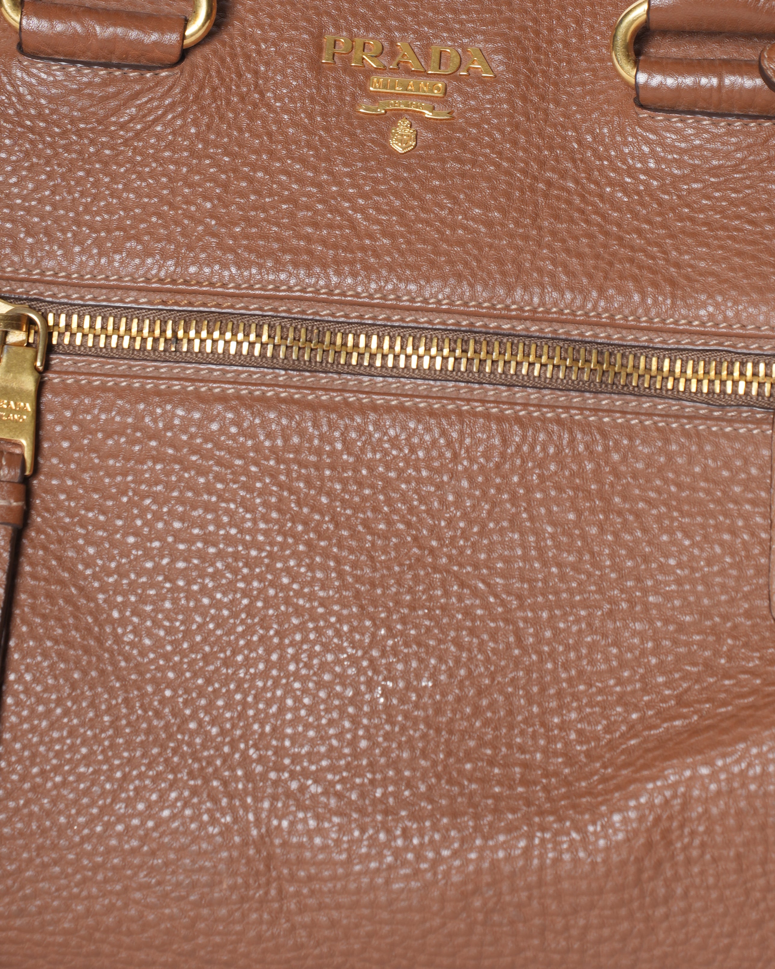 Prada Vitello Top Handle Bag In Brown