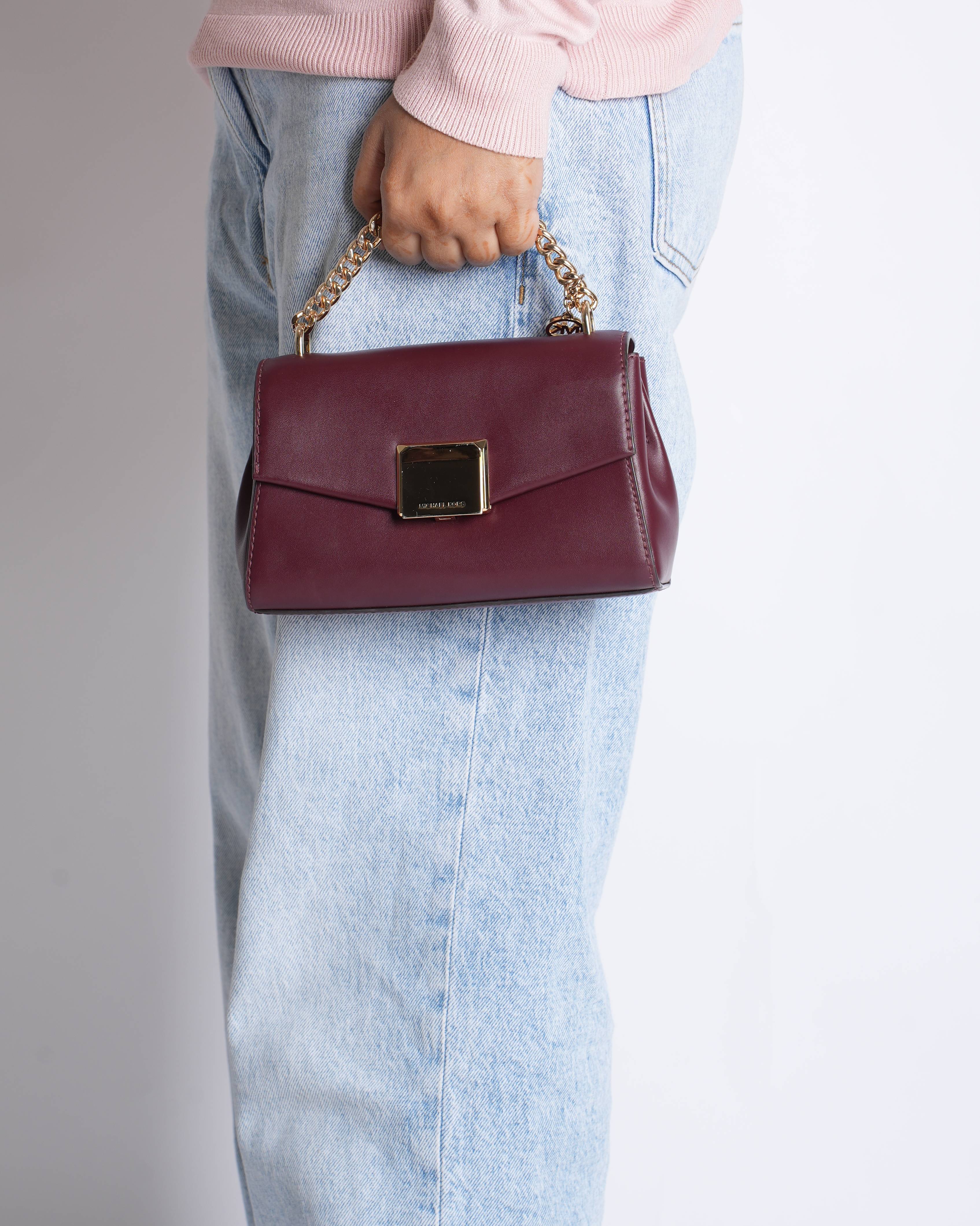Michael Kors 
Maroon sling bag