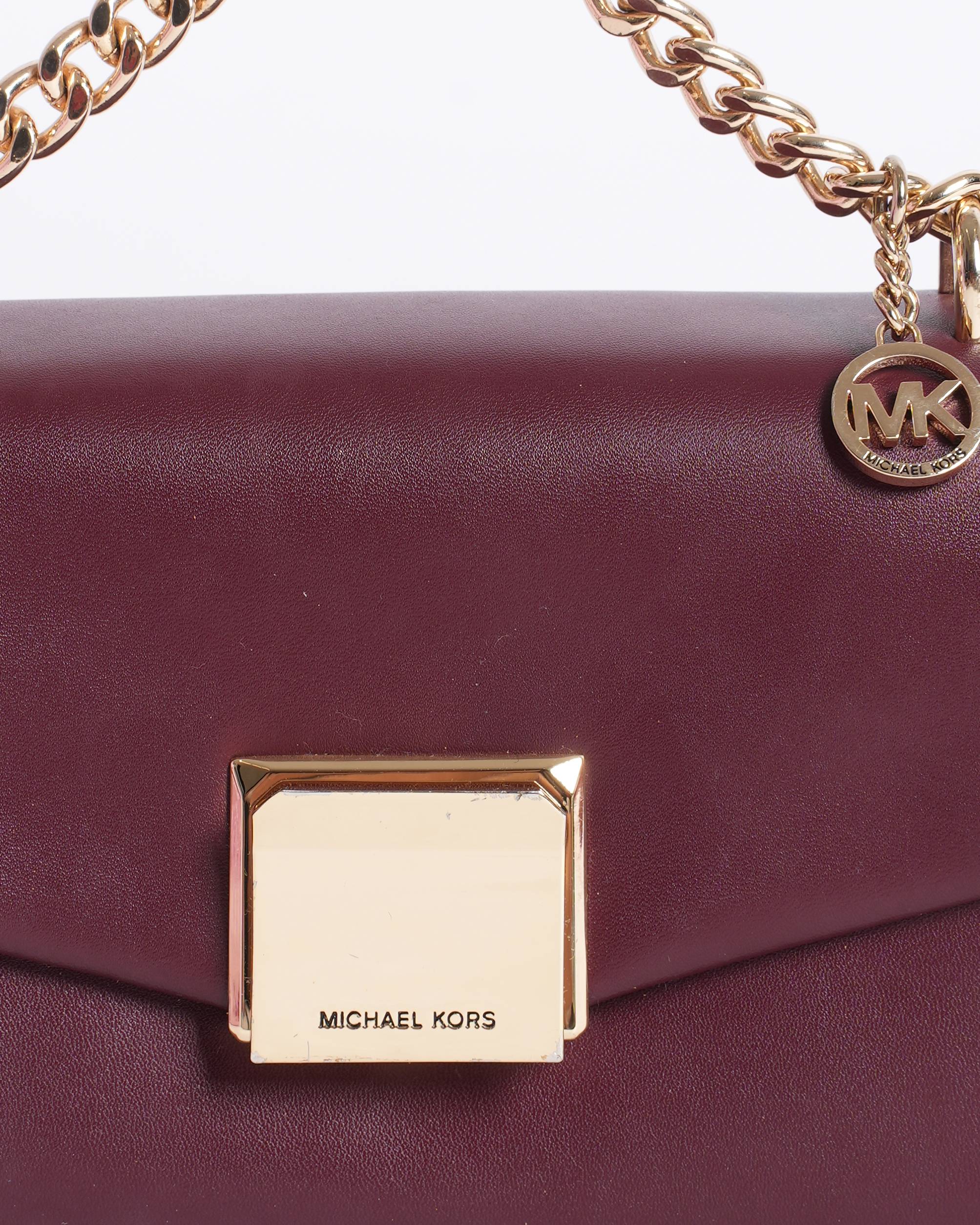 Michael Kors 
Maroon sling bag