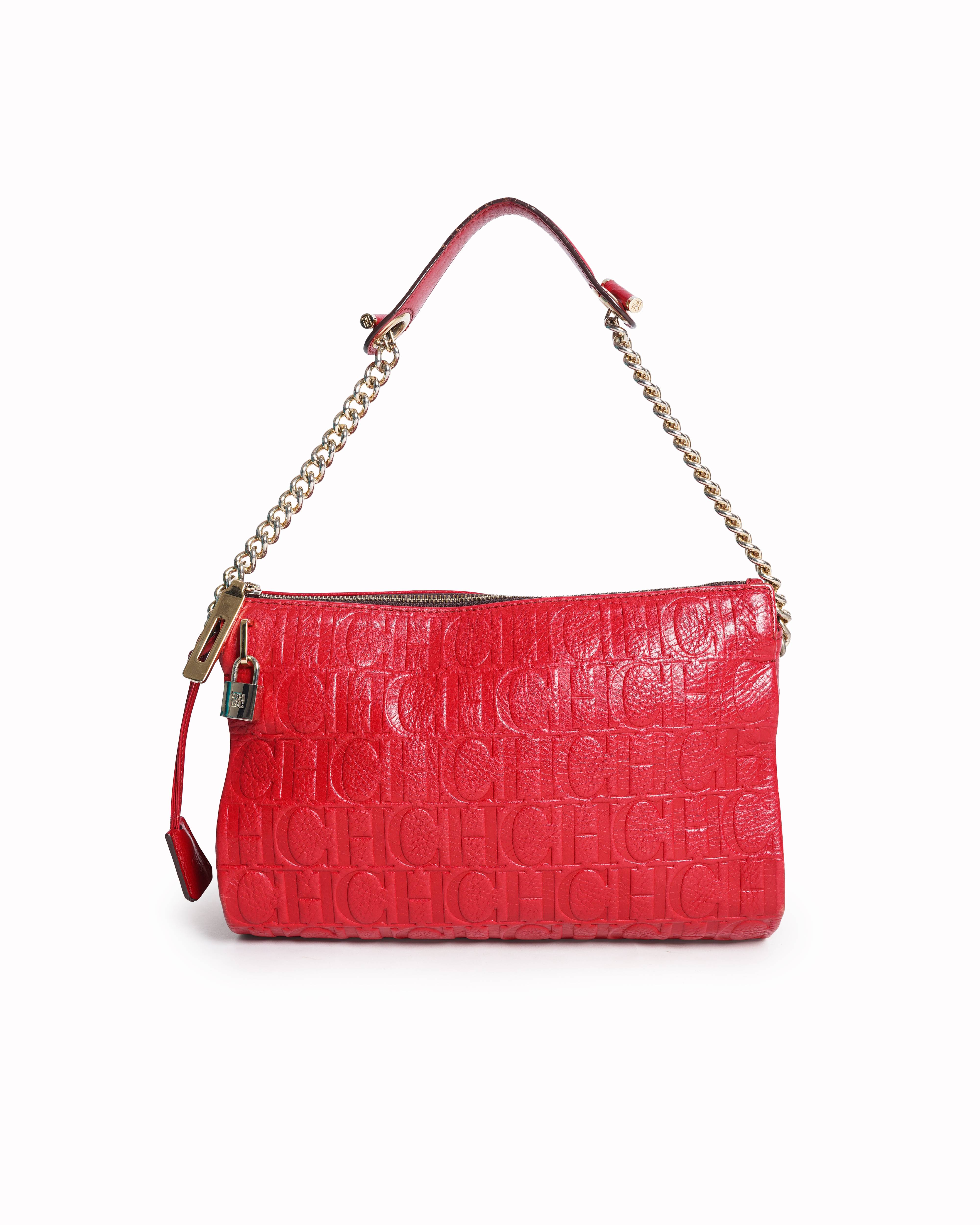 Caroline herrera red monogram embossed leather clutch with chain