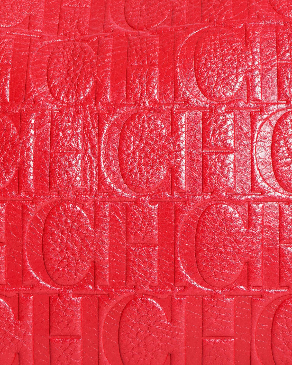 Caroline herrera red monogram embossed leather clutch with chain