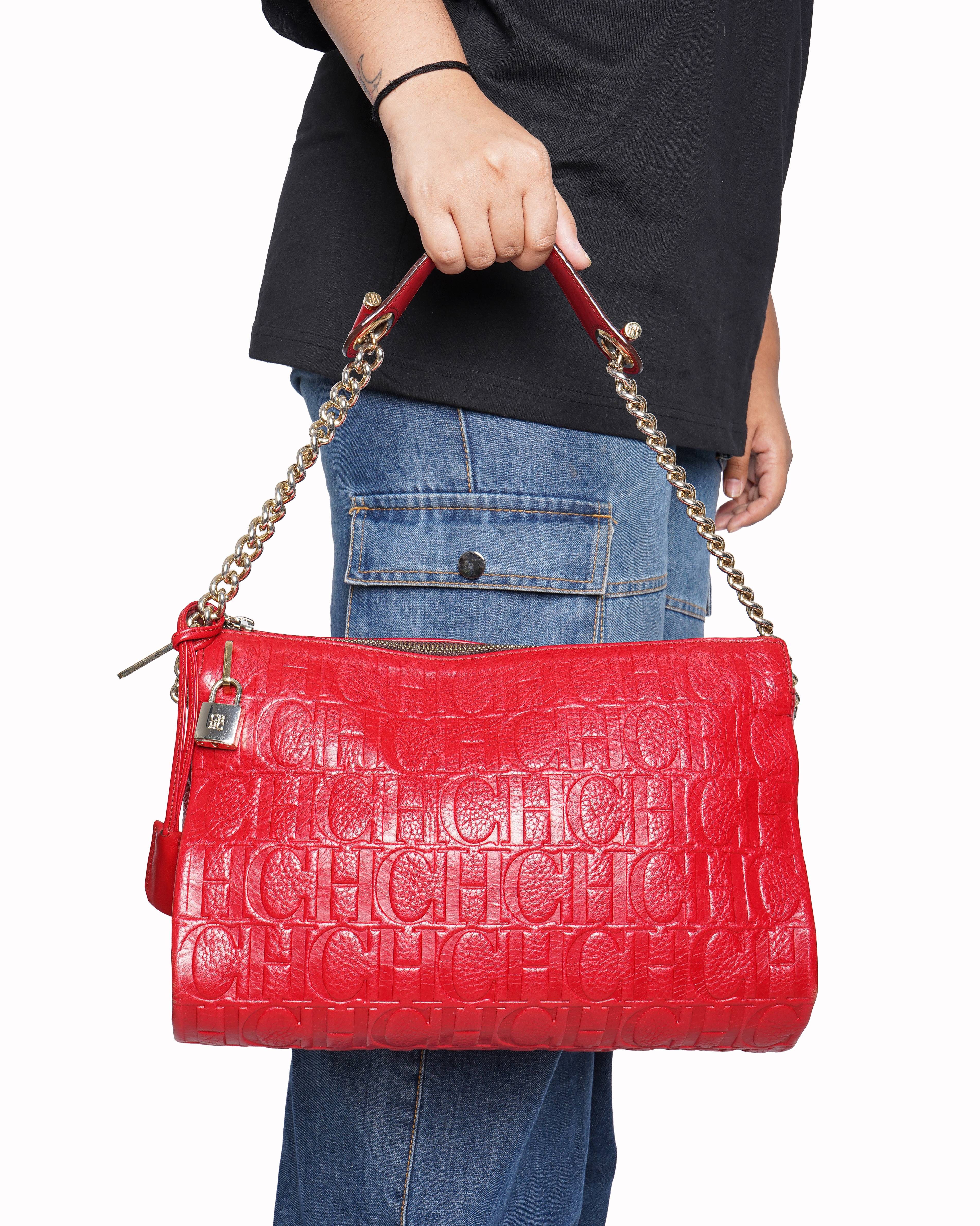 Caroline herrera red monogram embossed leather clutch with chain