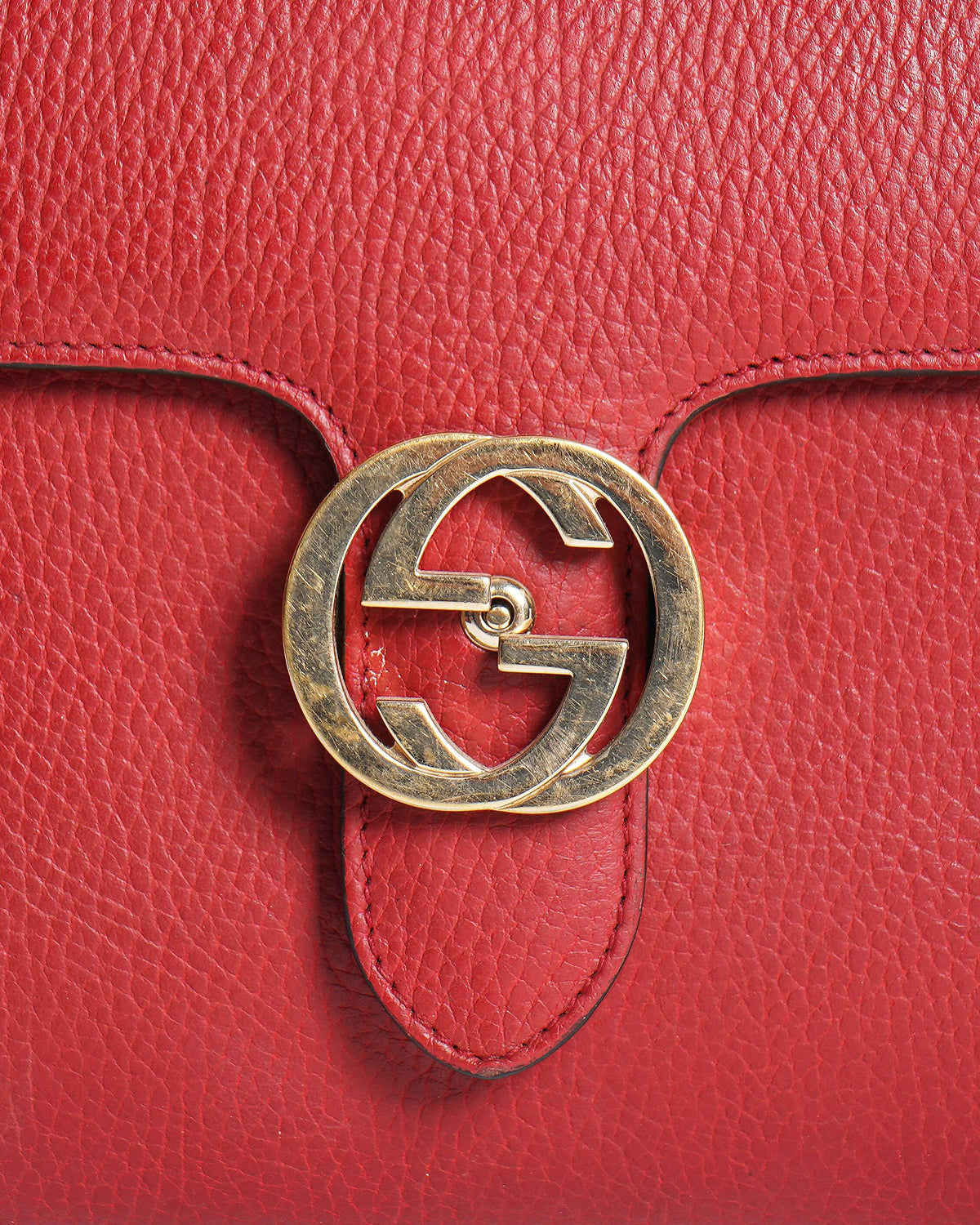 Gucci 
Red Leather Dollar Interlocking G Top Handle Bag