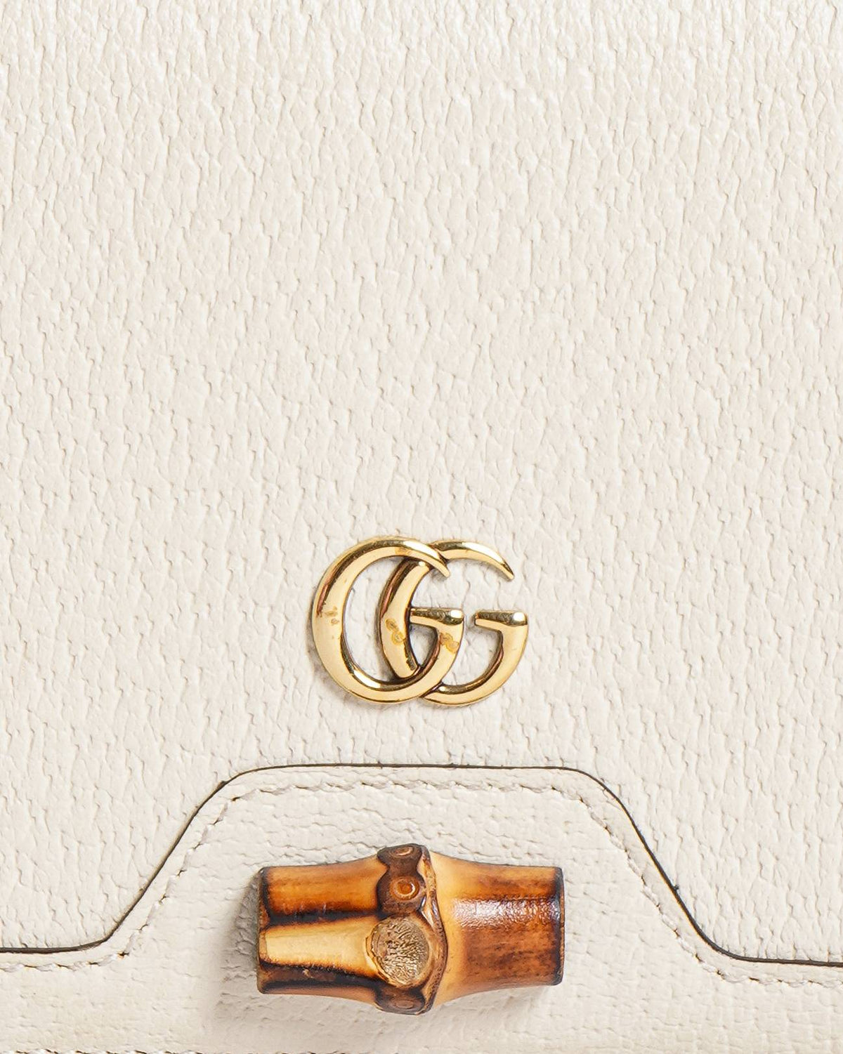 Gucci 
Diana Mini bag with bamboo crossbody bag