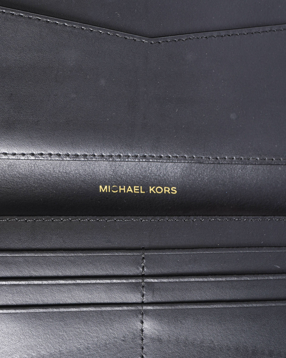 Michael Kors Embossed Monogram Zip Around Wallet In Black