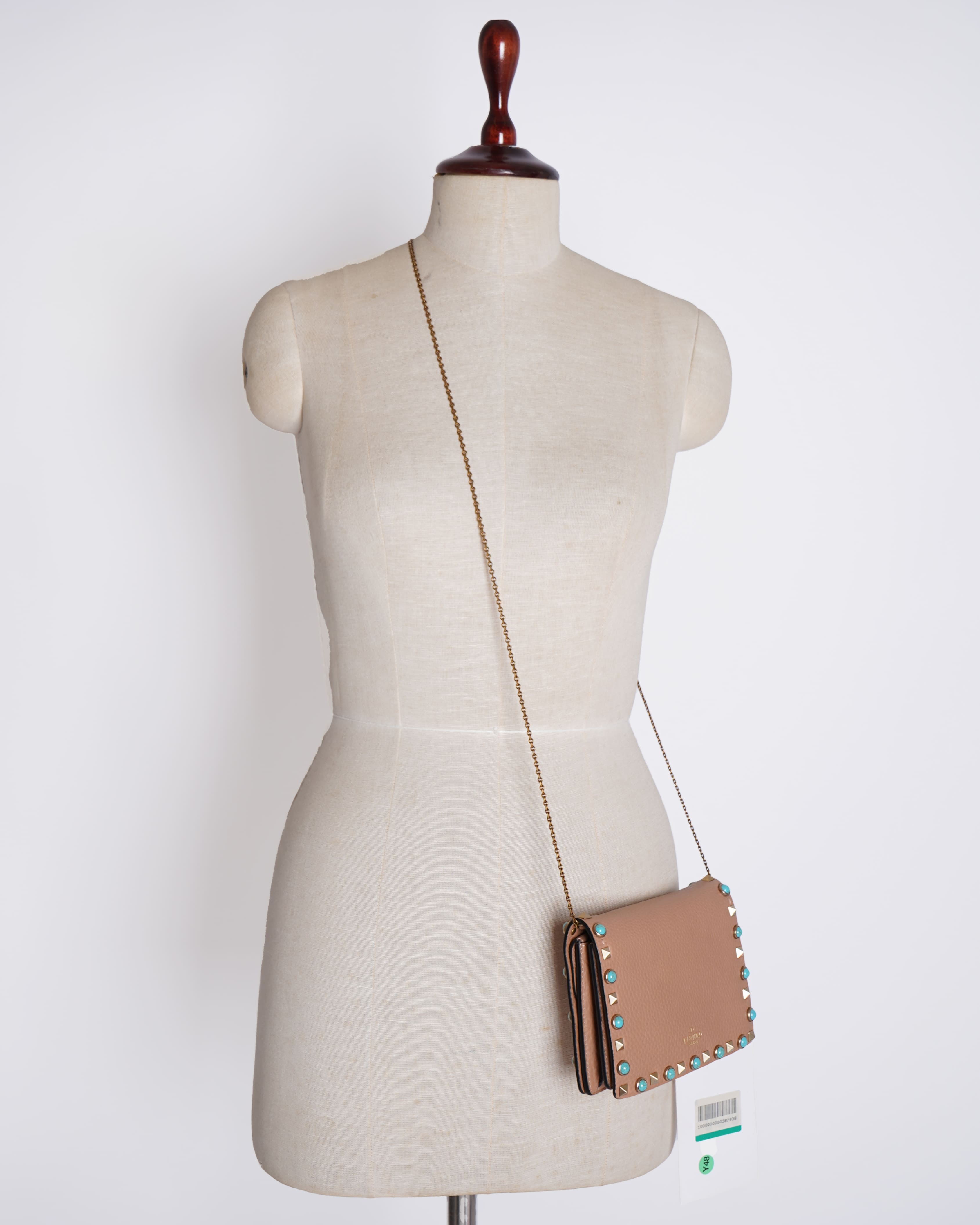 Valentino grained leather rolling rockstud wristlet clutch