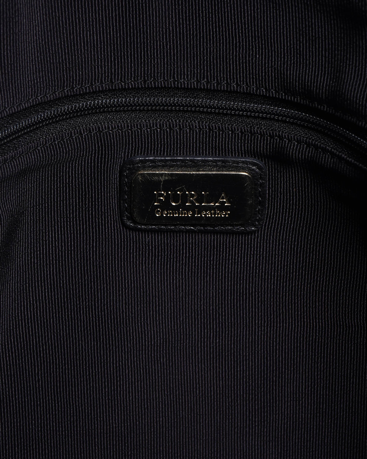 Furla 
black Grained leather hand bag