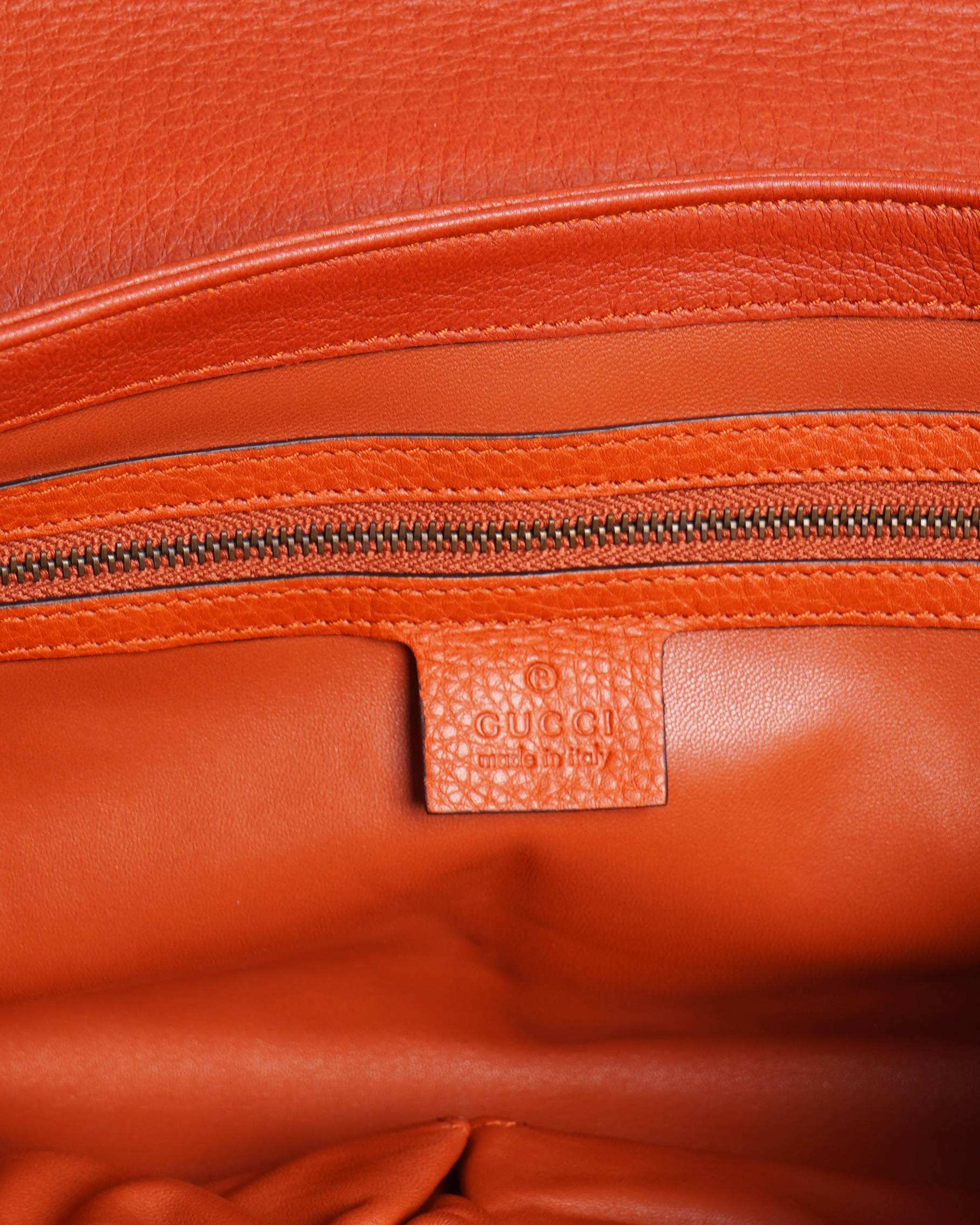 Gucci orange hip bamboo clutch
