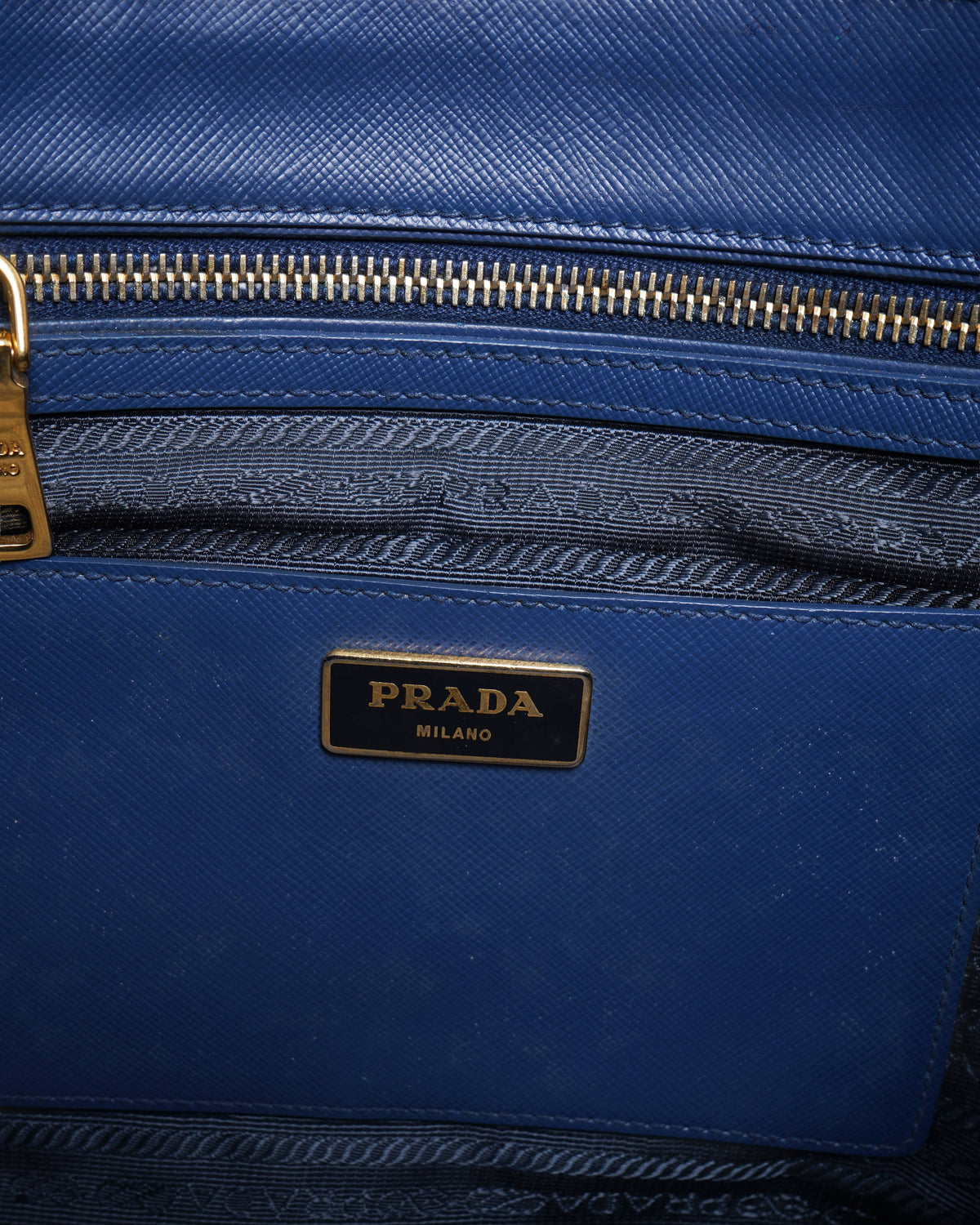 Prada 
blue saffiano leather bauletto satchel in black