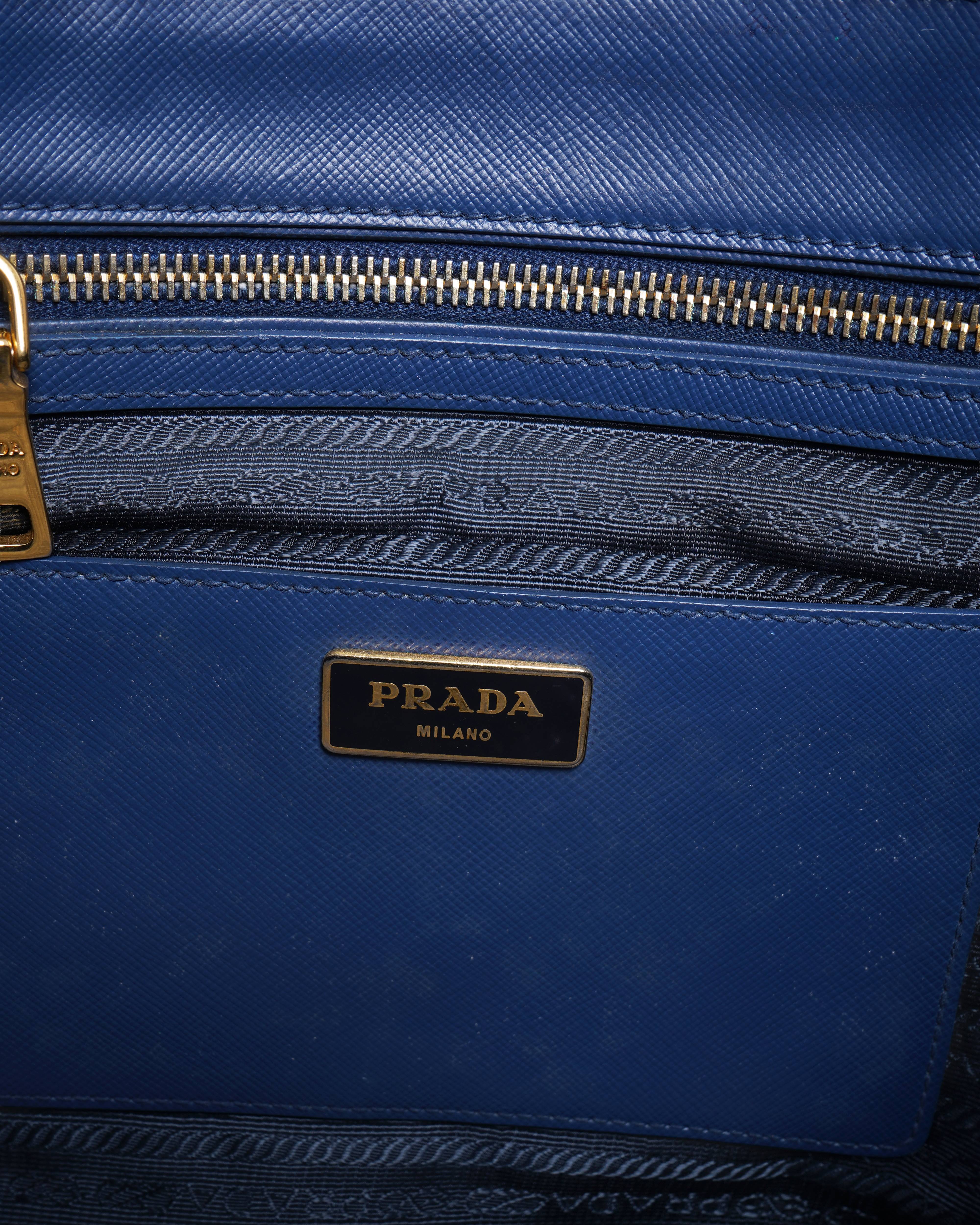 Prada 
blue saffiano leather bauletto satchel in black
